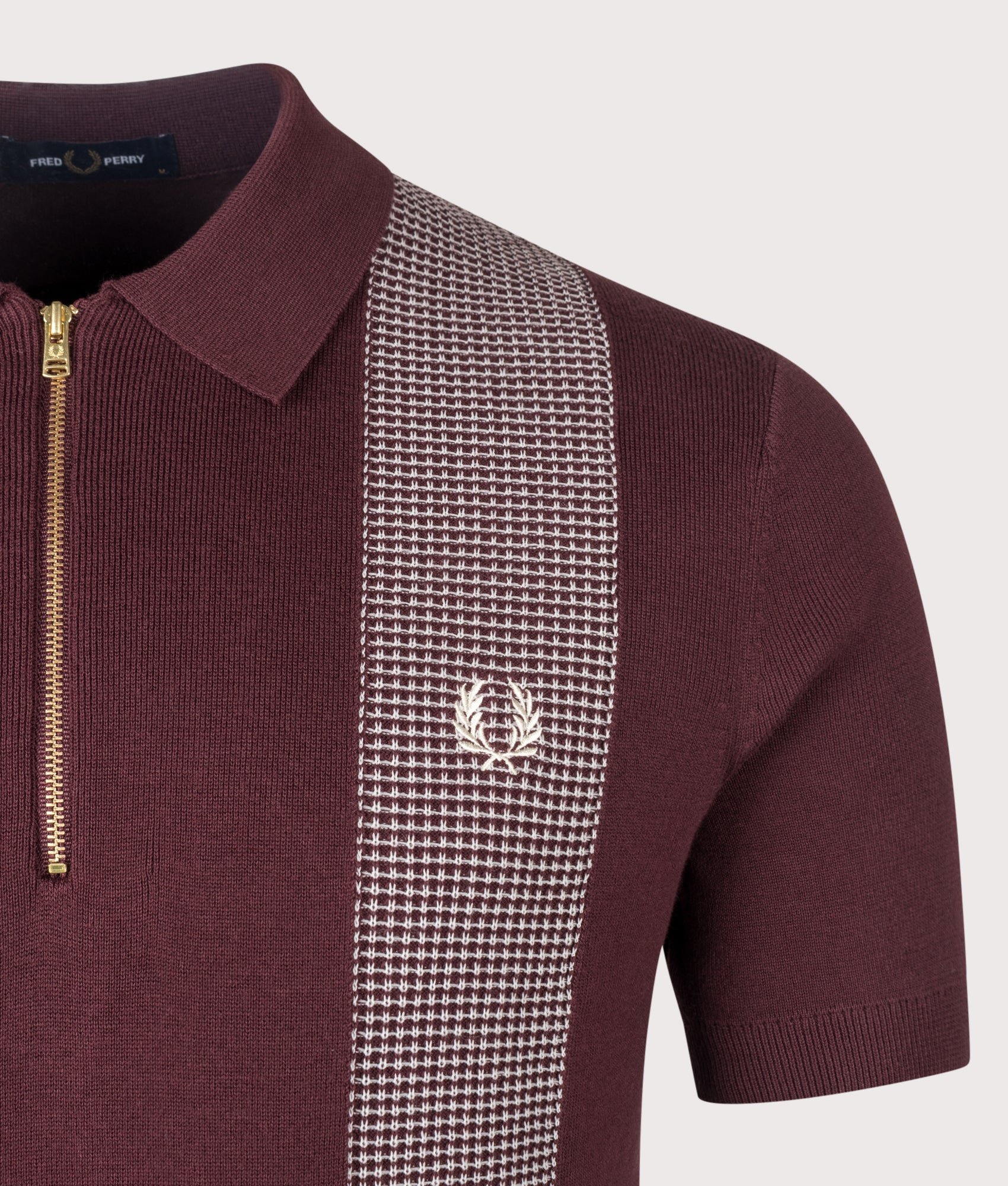 Fred Perry Panel Detail Knitted Polo Shirt in Oxblood at EQVVS Menswear. Detail shot.