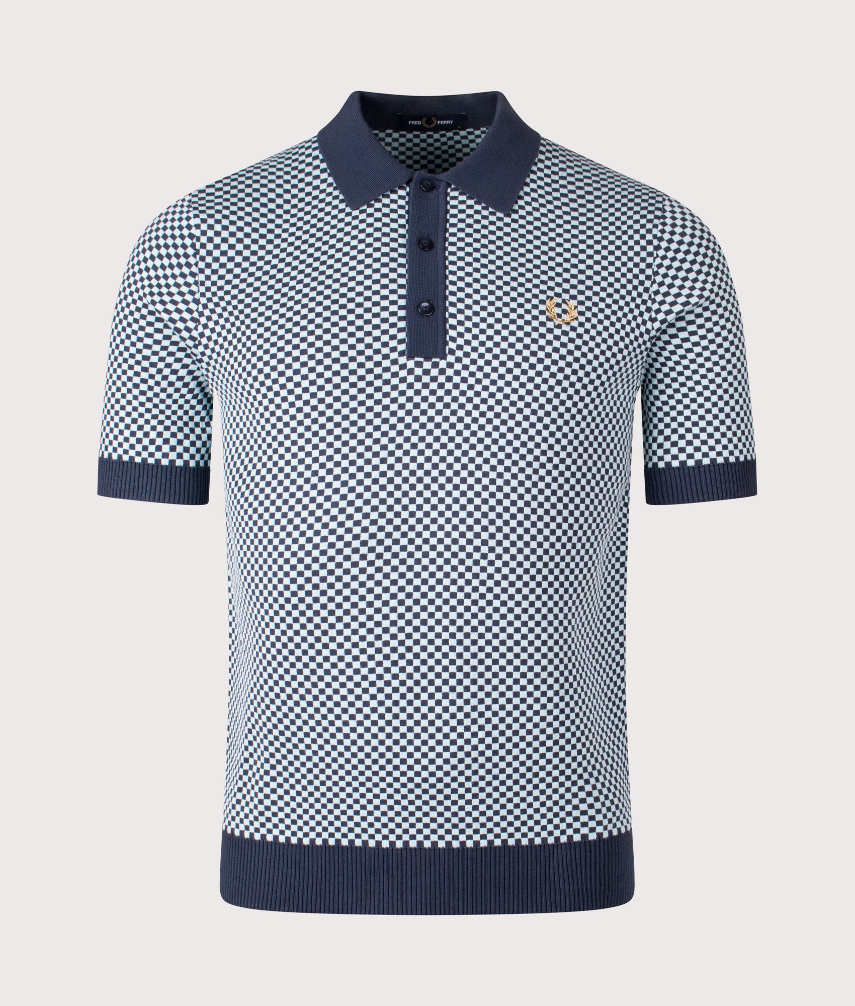 Fred Perry Chequerboard Knitted Polo Shirt in Dark Airforce at EQVVS Menswear. Front shot.