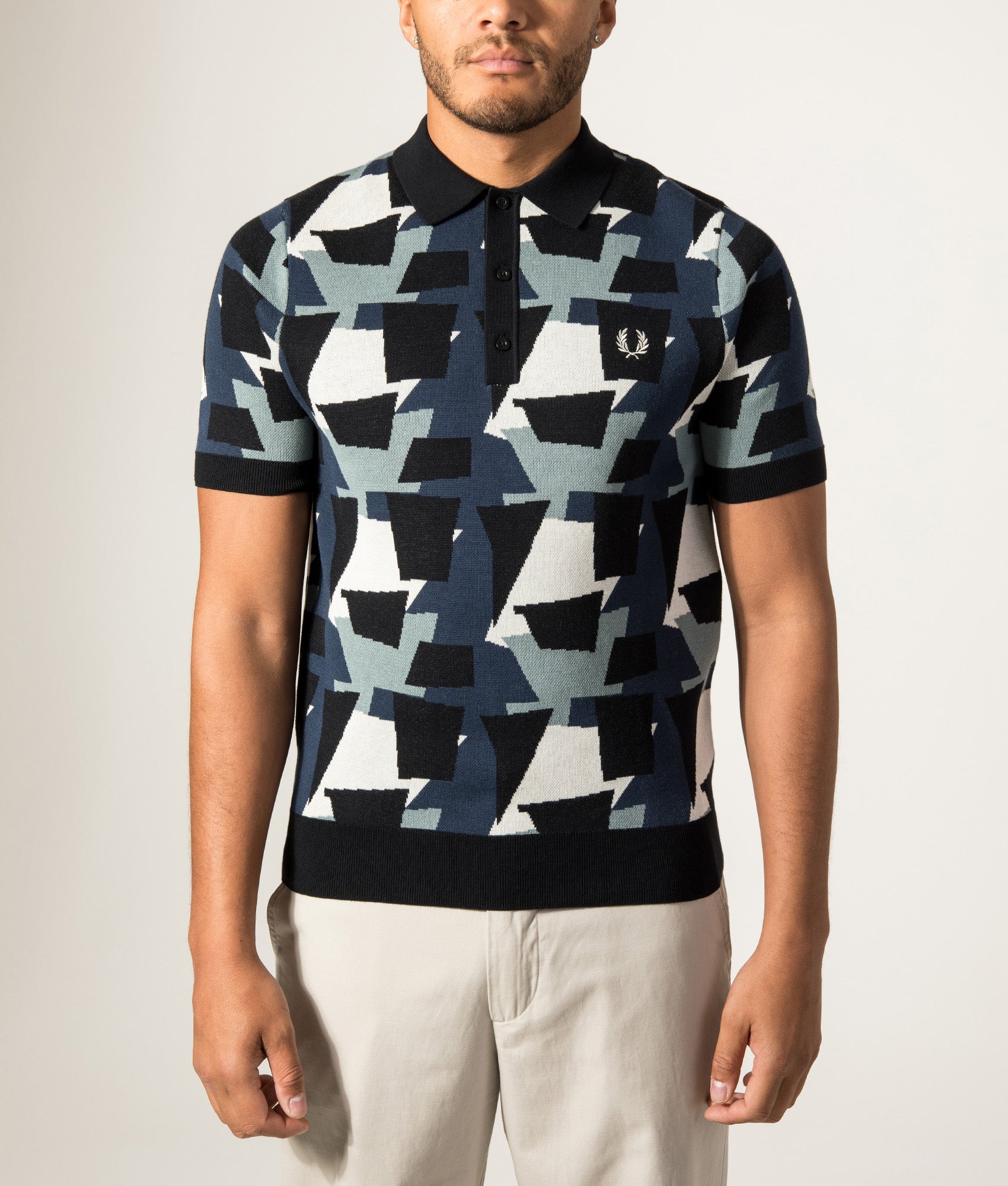 Fred Perry Fragment Jacquard Knit Polo Shirt in Black at EQVVS Menswear. Model front shot.