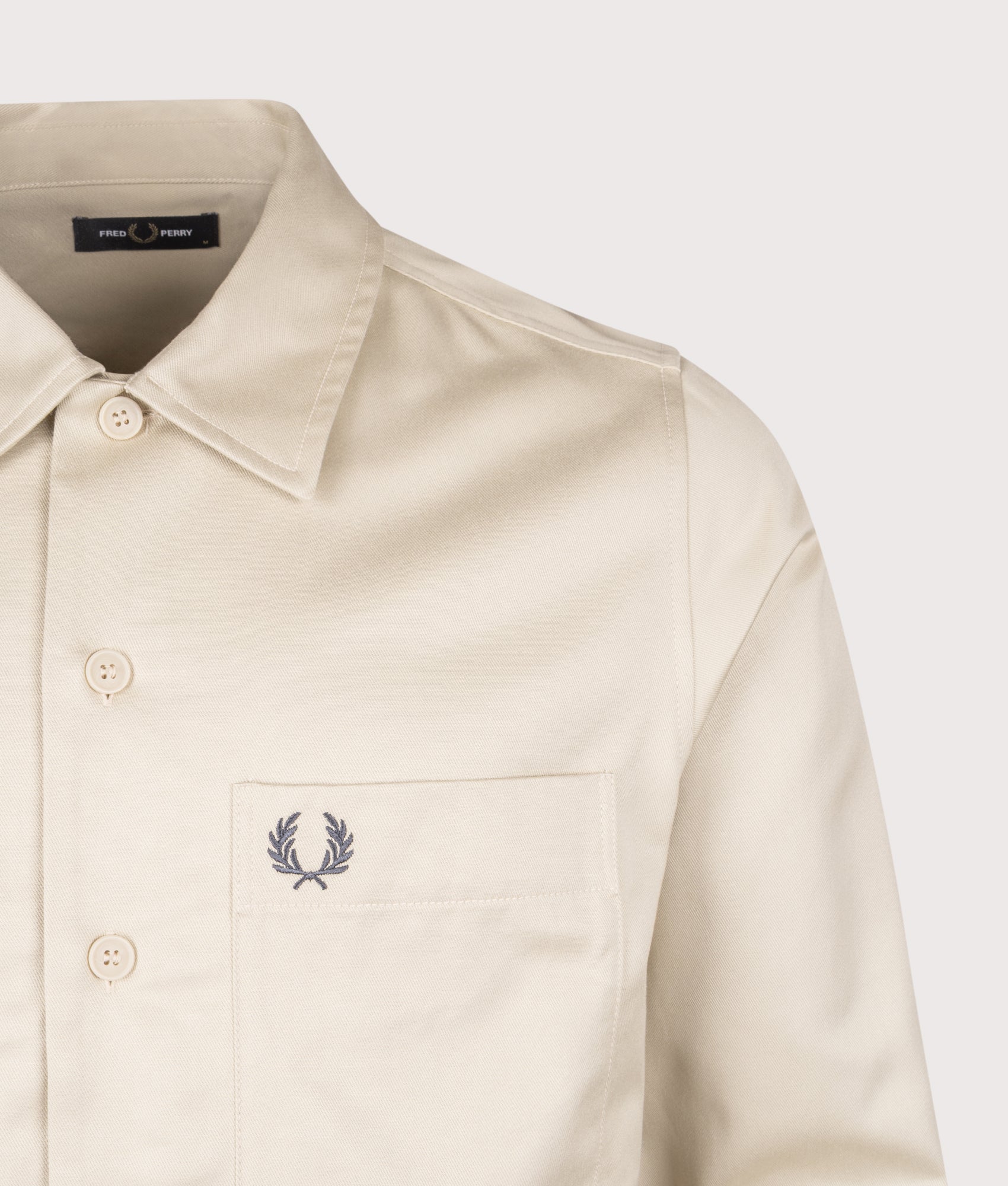 Fred Perry Twill Overshirt in Oatmeal at EQVVS Menswear. Detail shot.