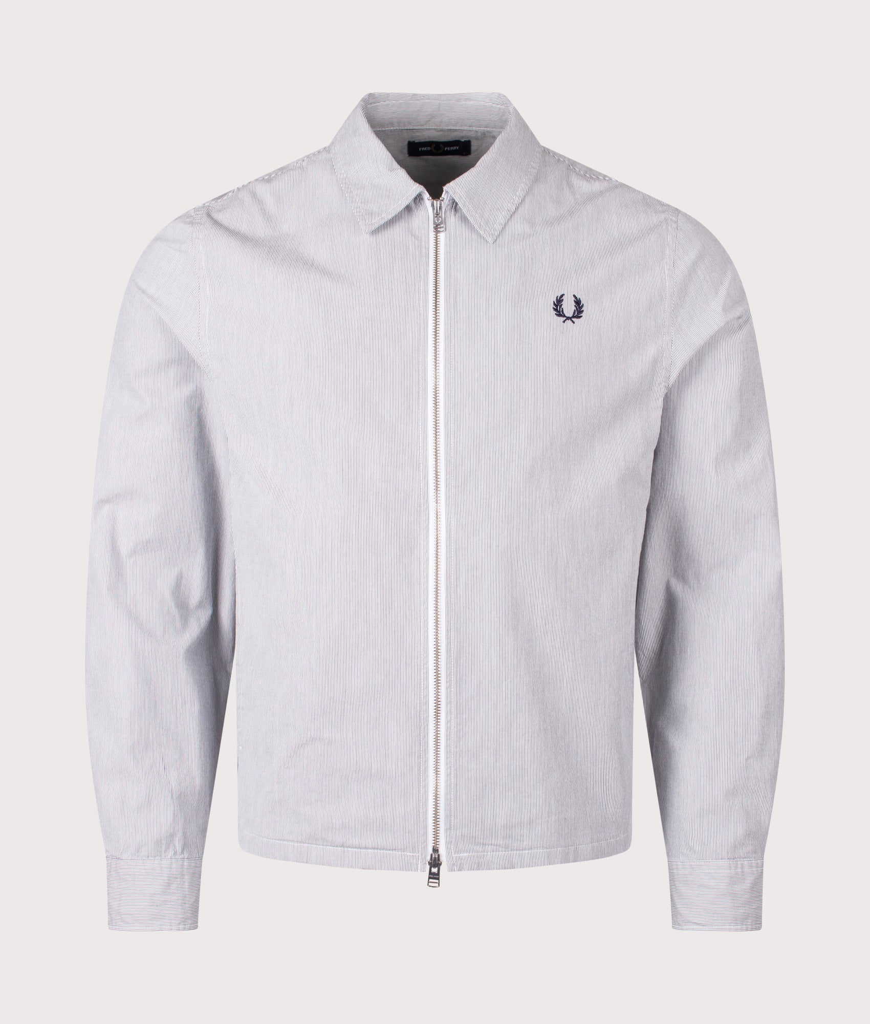 Fred Perry Striped Seersucker Zip Through Overshirt in Blue and White at EQVVS Menswear. Front shot.