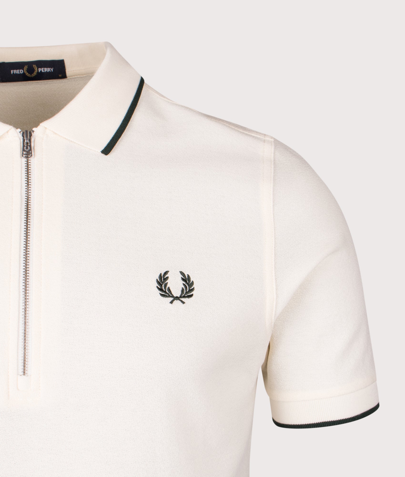 Fred Perry Crepe Piqué Polo Shirt in Ecru at EQVVS Menswear. Detail shot.