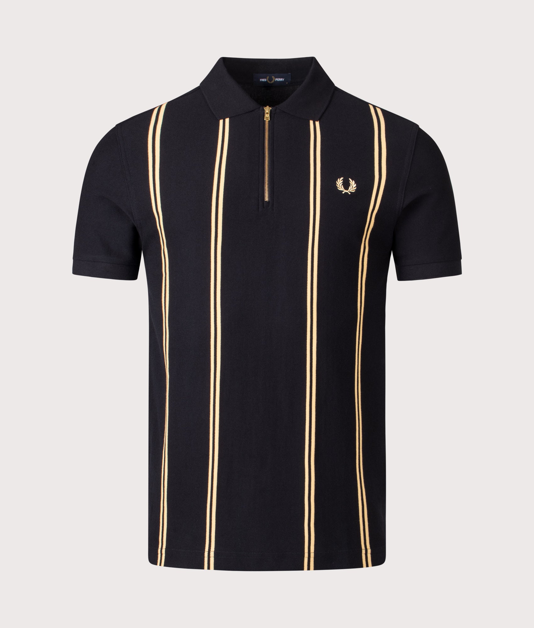 Fred Perry Vertical Stripe Zip Neck Polo Shirt in Black and Champagne at EQVVS Menswear. Front shot.