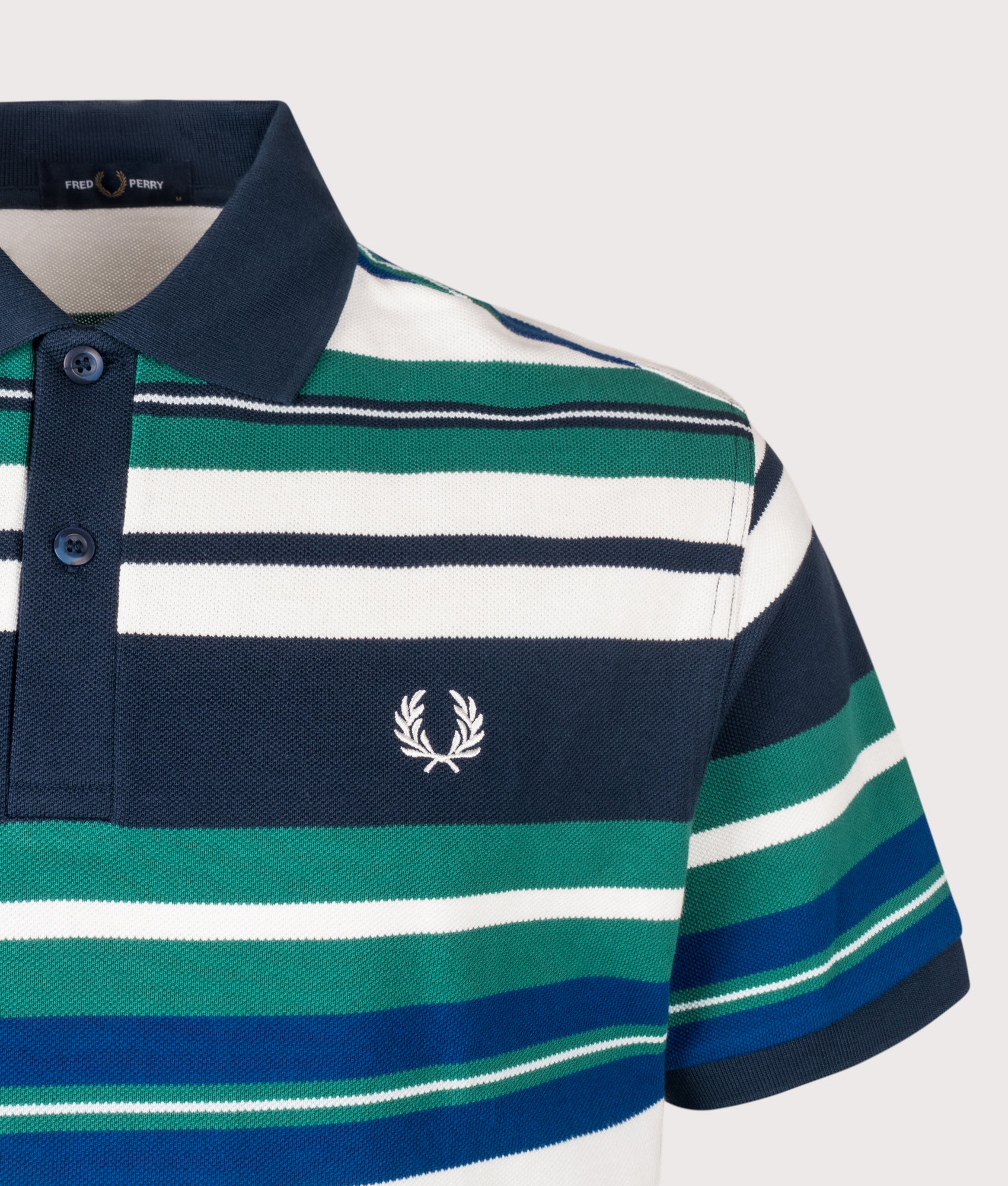 Fred Perry Relaxed Fit Striped Polo Shirt   in Deep Mint at EQVVS Menswear. Detail shot.