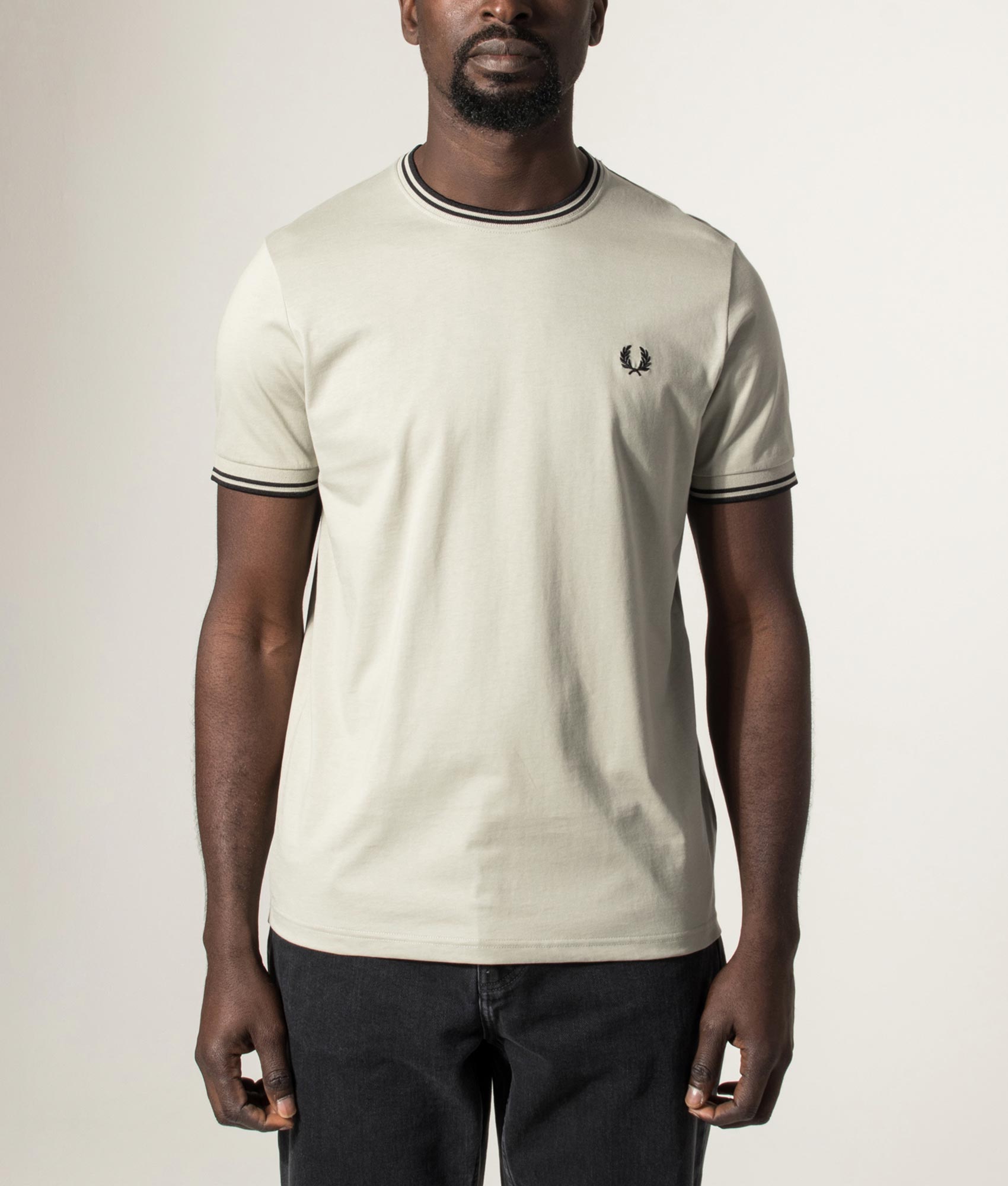 Fred Perry Twin Tipped T-Shirt in Seagrass and Black at EQVVS Menswear. Model front shot.