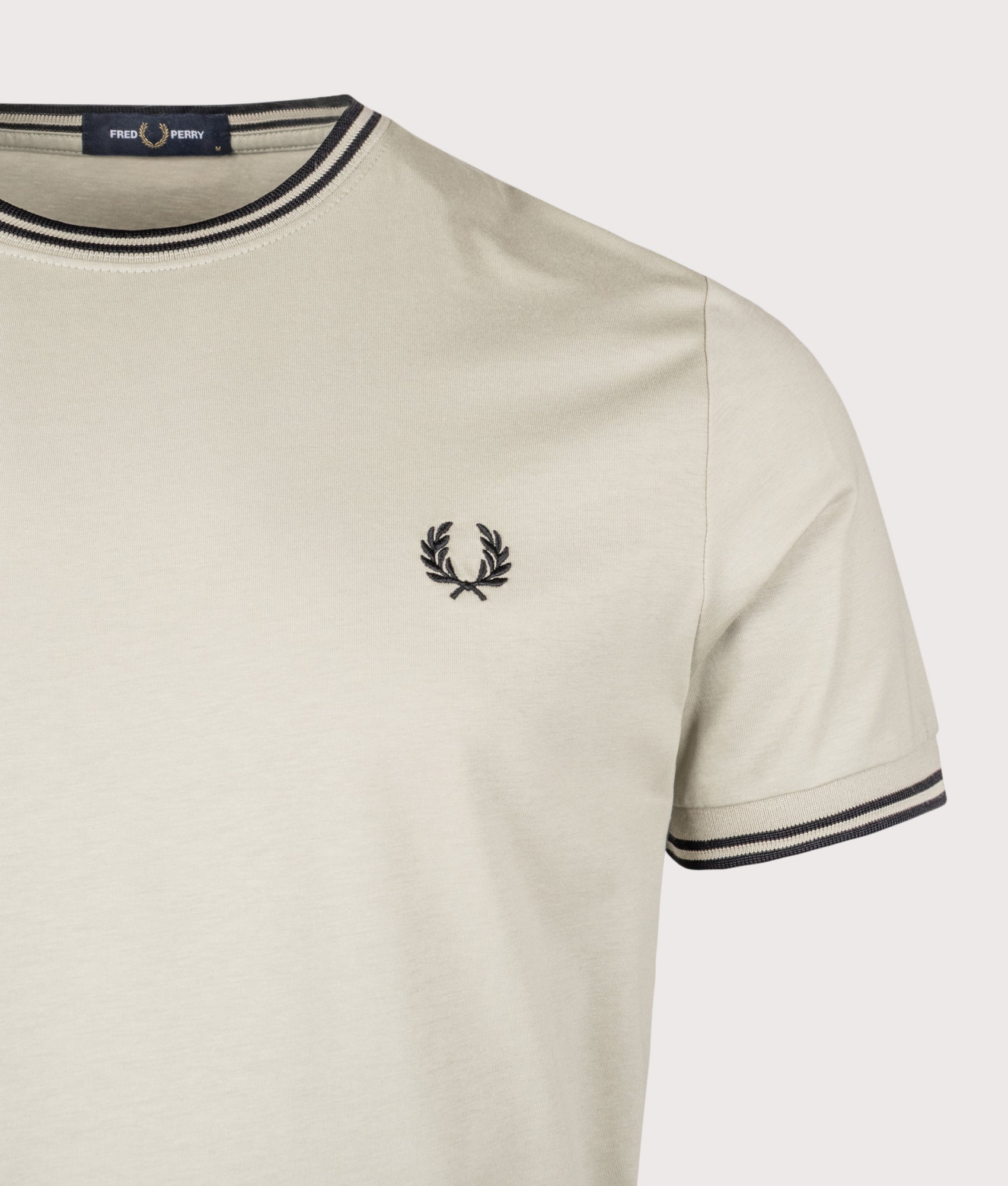 Fred Perry Twin Tipped T-Shirt in Seagrass and Black at EQVVS Menswear.  Detail shot.