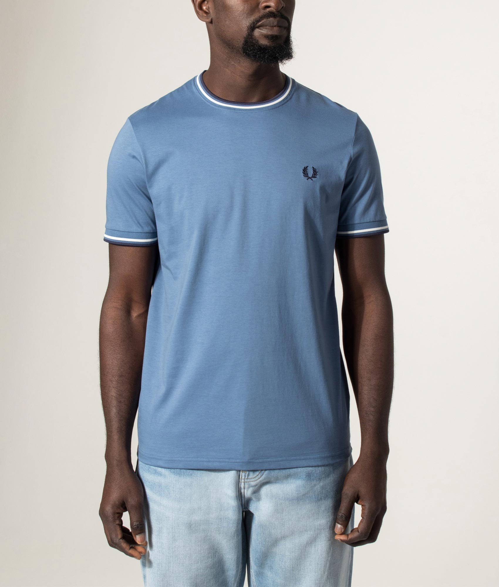 Fred Perry Twin Tipped T-Shirt in Ace Blue, Snow White and Tennis Blue at EQVVS Menswear. Model front shot.