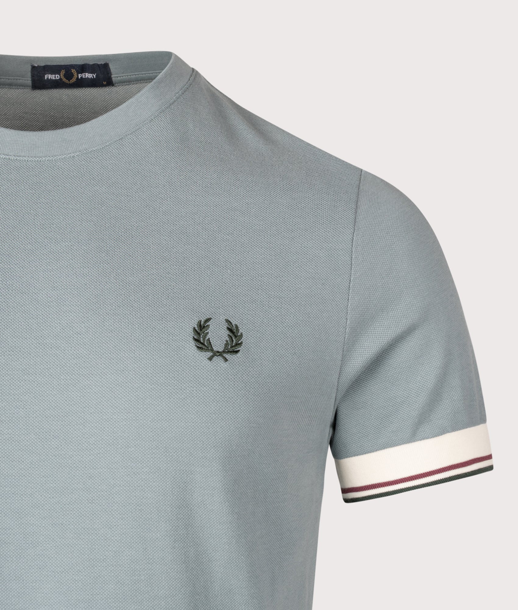 Fred Perry Twin Tipped Cuff T-Shirt in  stockport blue at EQVVS Menswear. Detail shot.