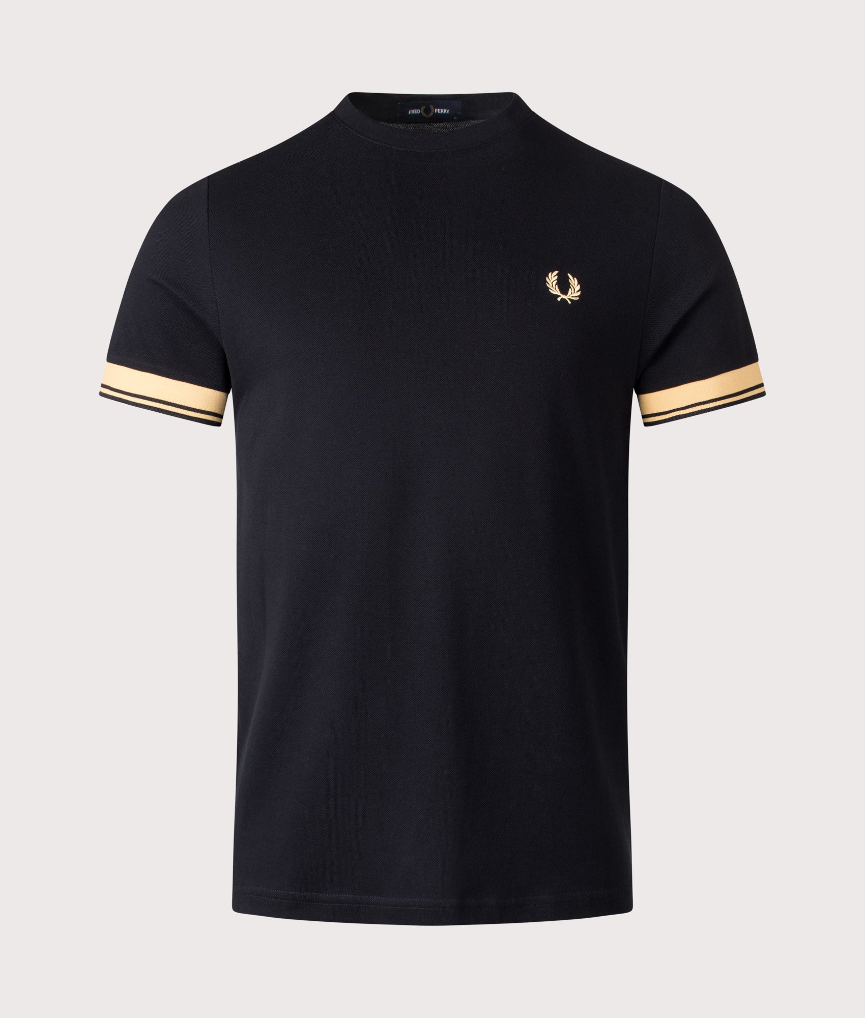 Fred Perry Twin Tipped Cuff T-Shirt in Champagne and Black at EQVVS Menswear. Front shot. 