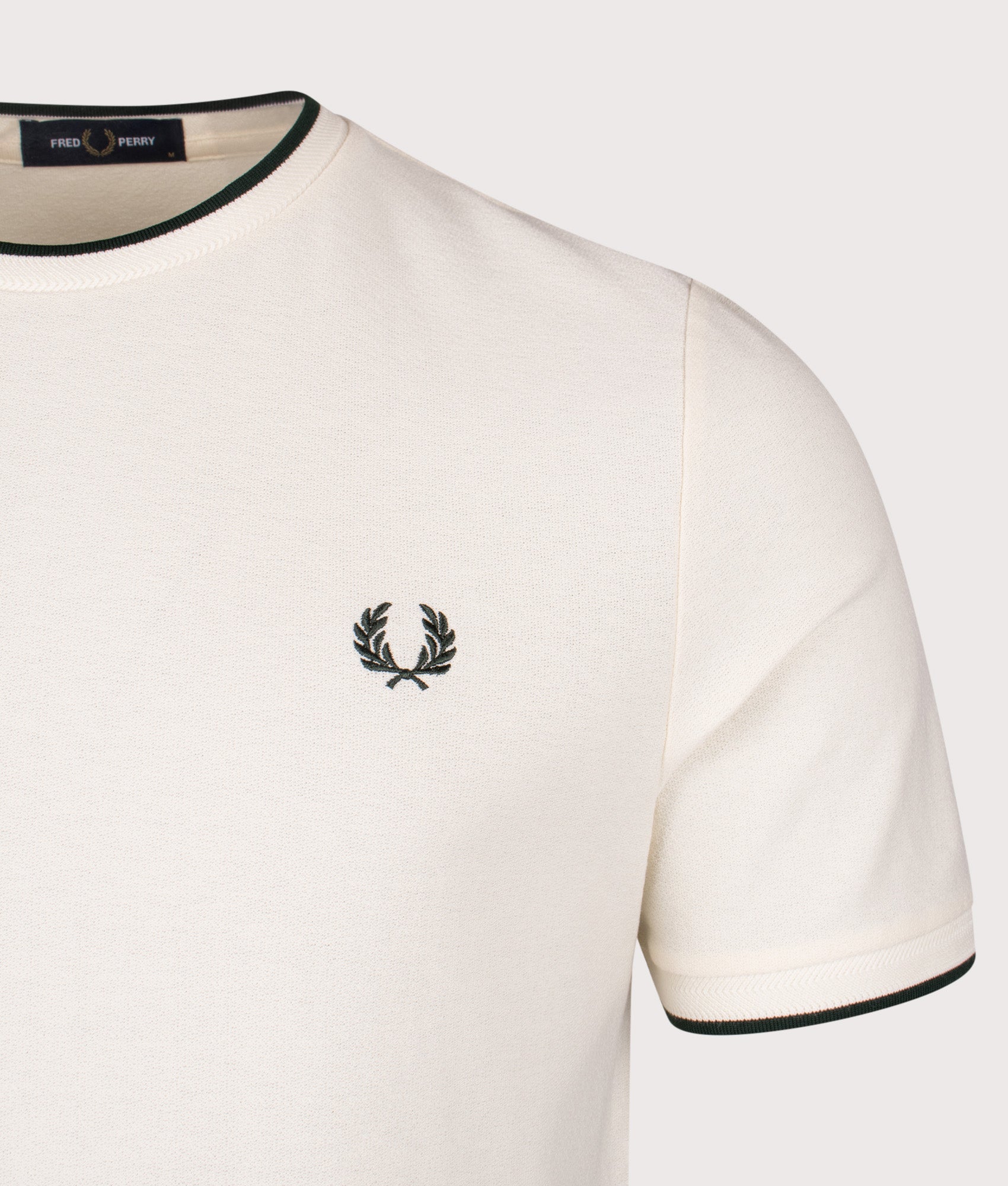 Fred Perry Trim Detail Crepe Piqué T-Shirt in Ecru at EQVVS Menswear. Detail shot.
