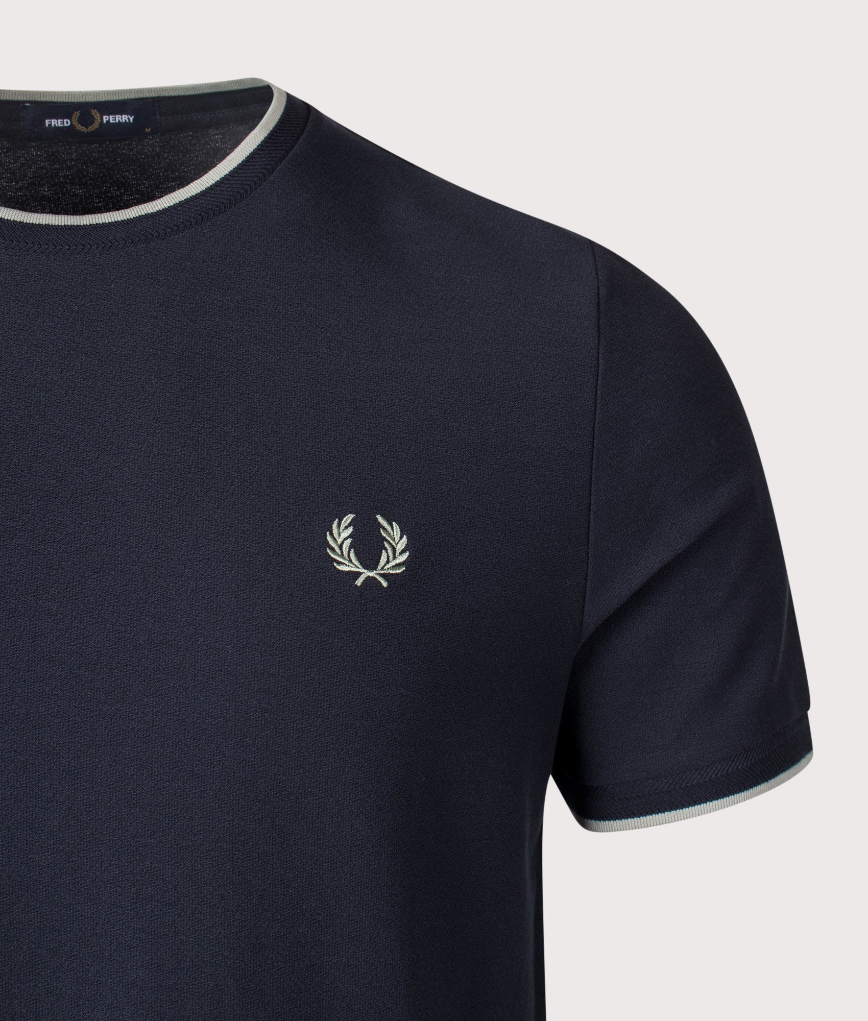 Fred Perry Trim Detail Crepe Piqué T-Shirt in Navy at EQVVS Menswear. Detail shot.