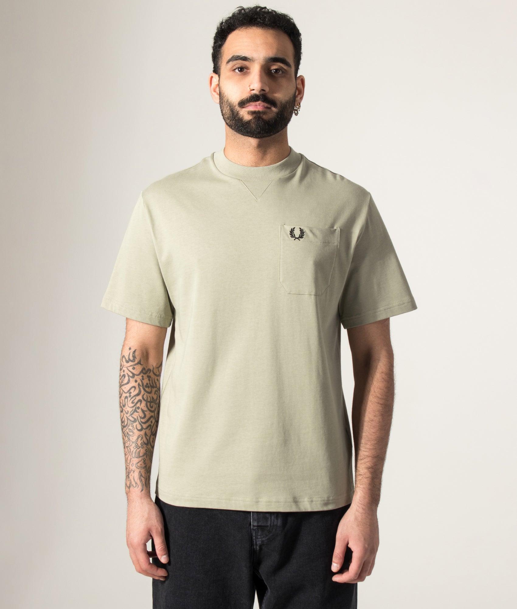 Fred Perry Relaxed Fit Pocket Detail T-Shirt in Seagrass at EQVVS Menswear. Model front shot.