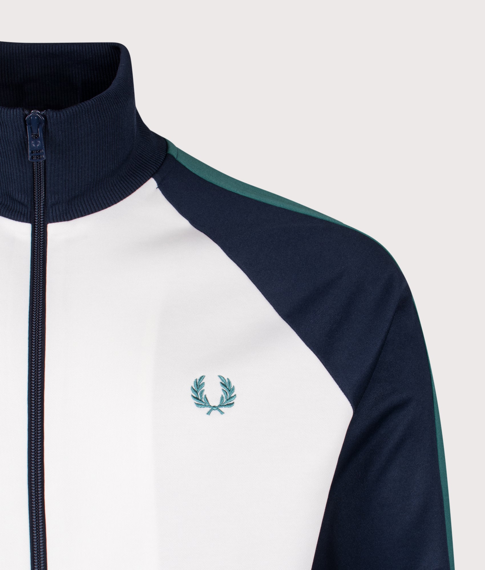 Fred Perry Contrast Sleeve Track Jacket in Snow White at EQVVS Menswear. Detail shot.