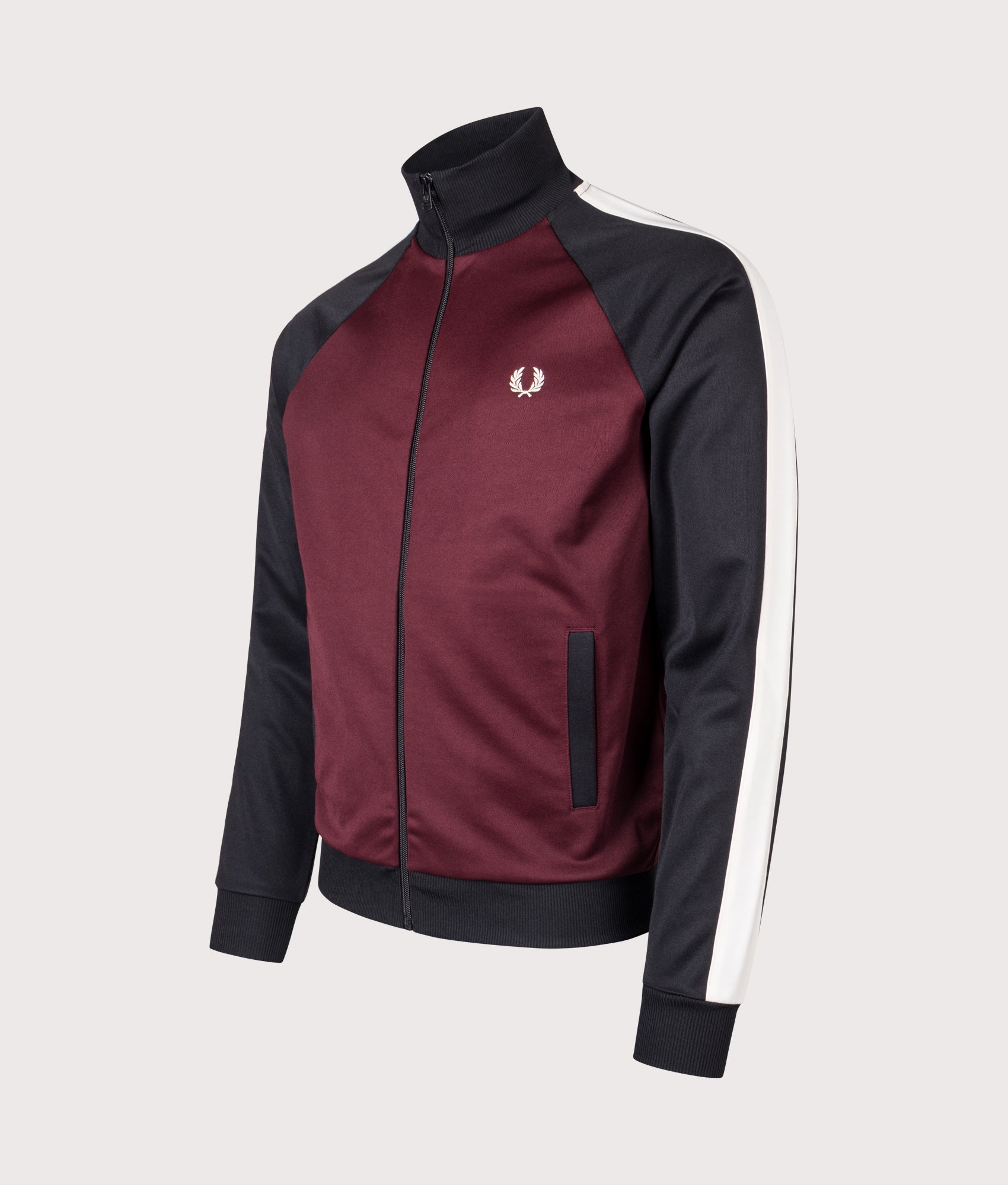 Fred Perry Contrast Sleeve Track Jacket in Oxblood at EQVVS Menswear. Angled front shot.