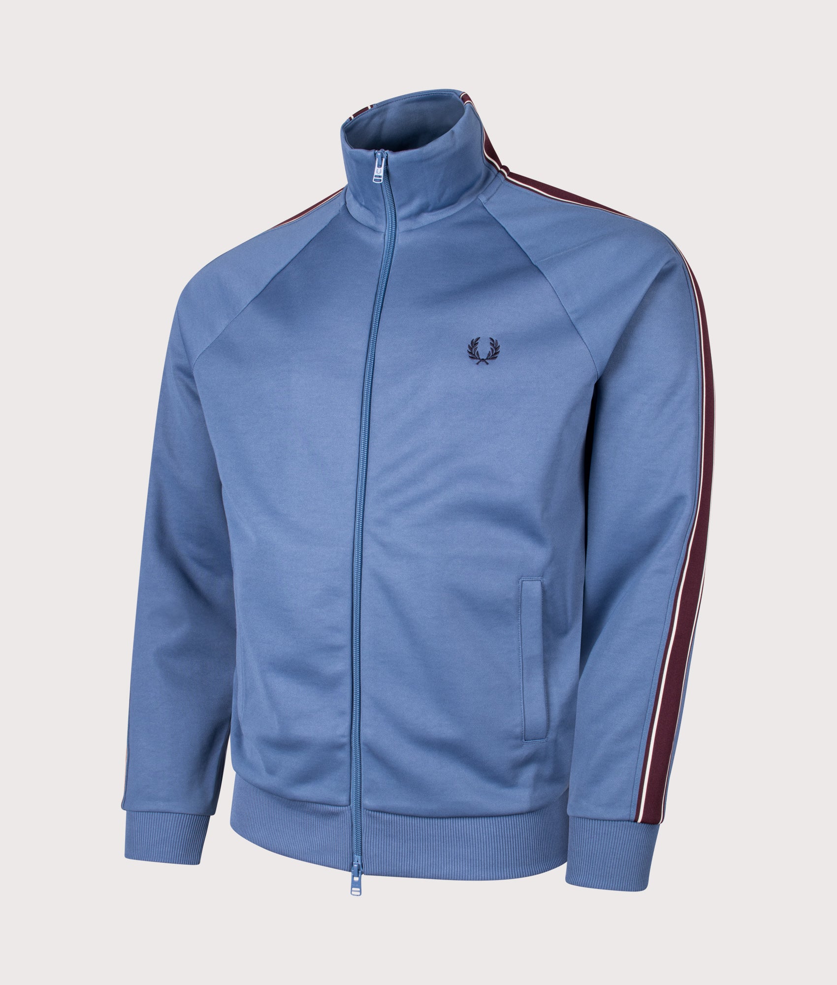 Tramline Tape Track Jacket in Ace Blue | Fred Perry | EQVVS Menswear | Angled front shot.