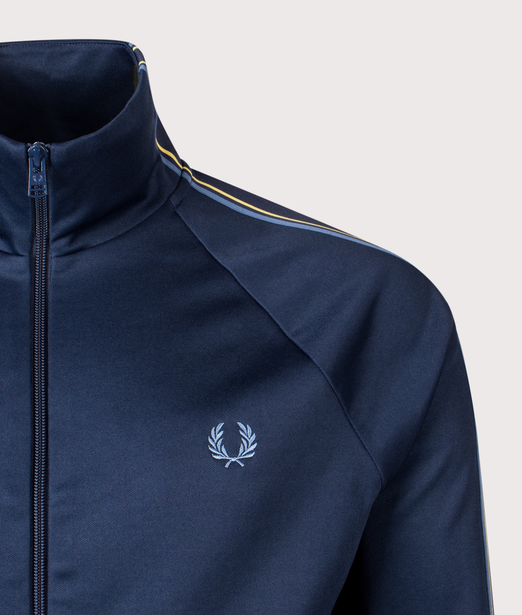 Fred Perry Tramline Tape Track Jacket in Tennis Blue at EQVVS Menswear. Detail shot.