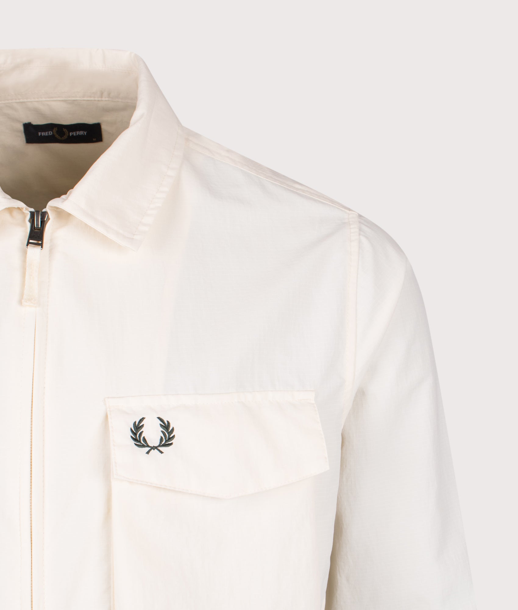 Fred Perry Ripstop Pocket Overshirt in Ecru at EQVVS Menswear. Detail shot.