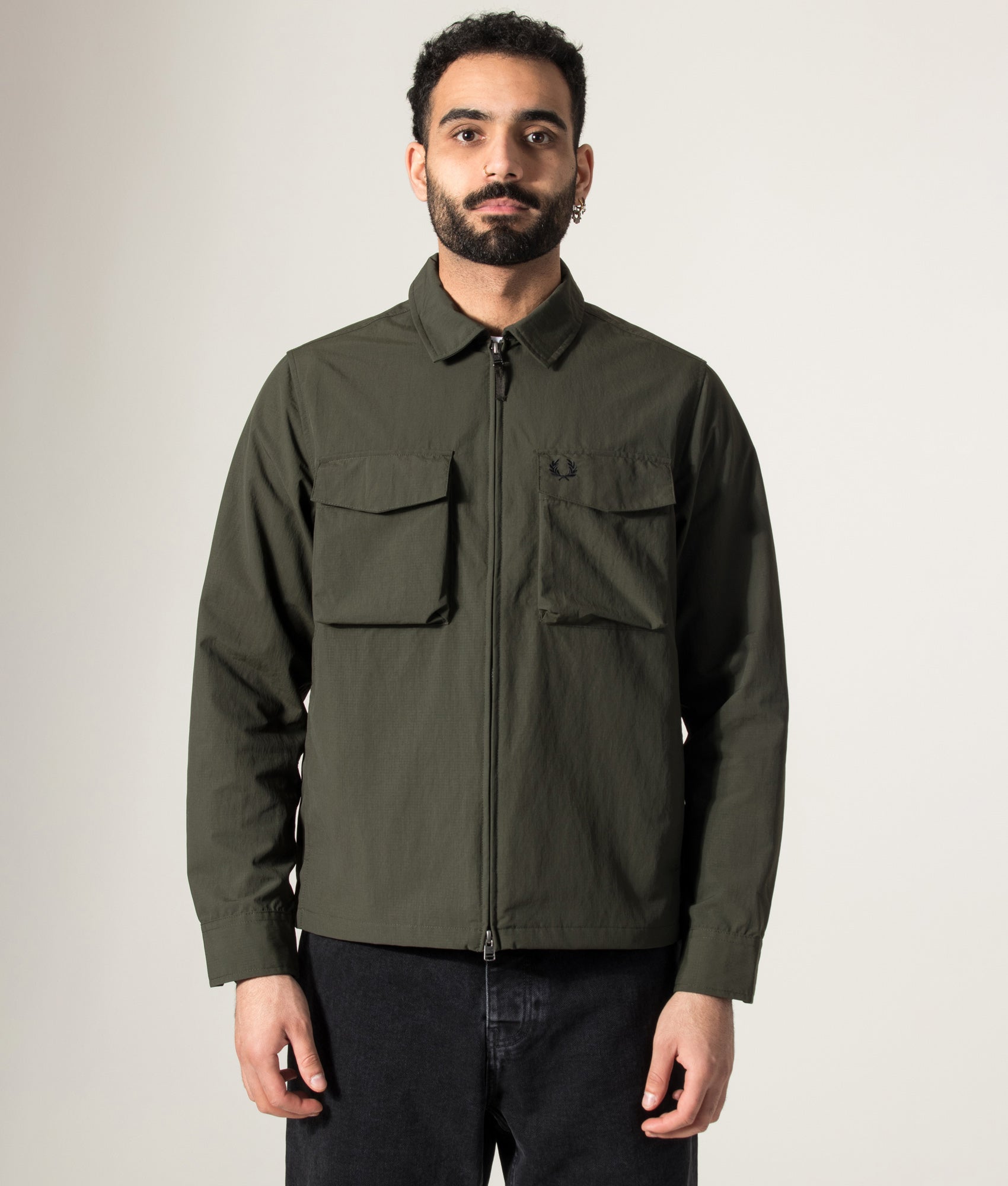 Fred Perry Ripstop Pocket Overshirt in Hunting Green at EQVVS Menswear. Model front shot.