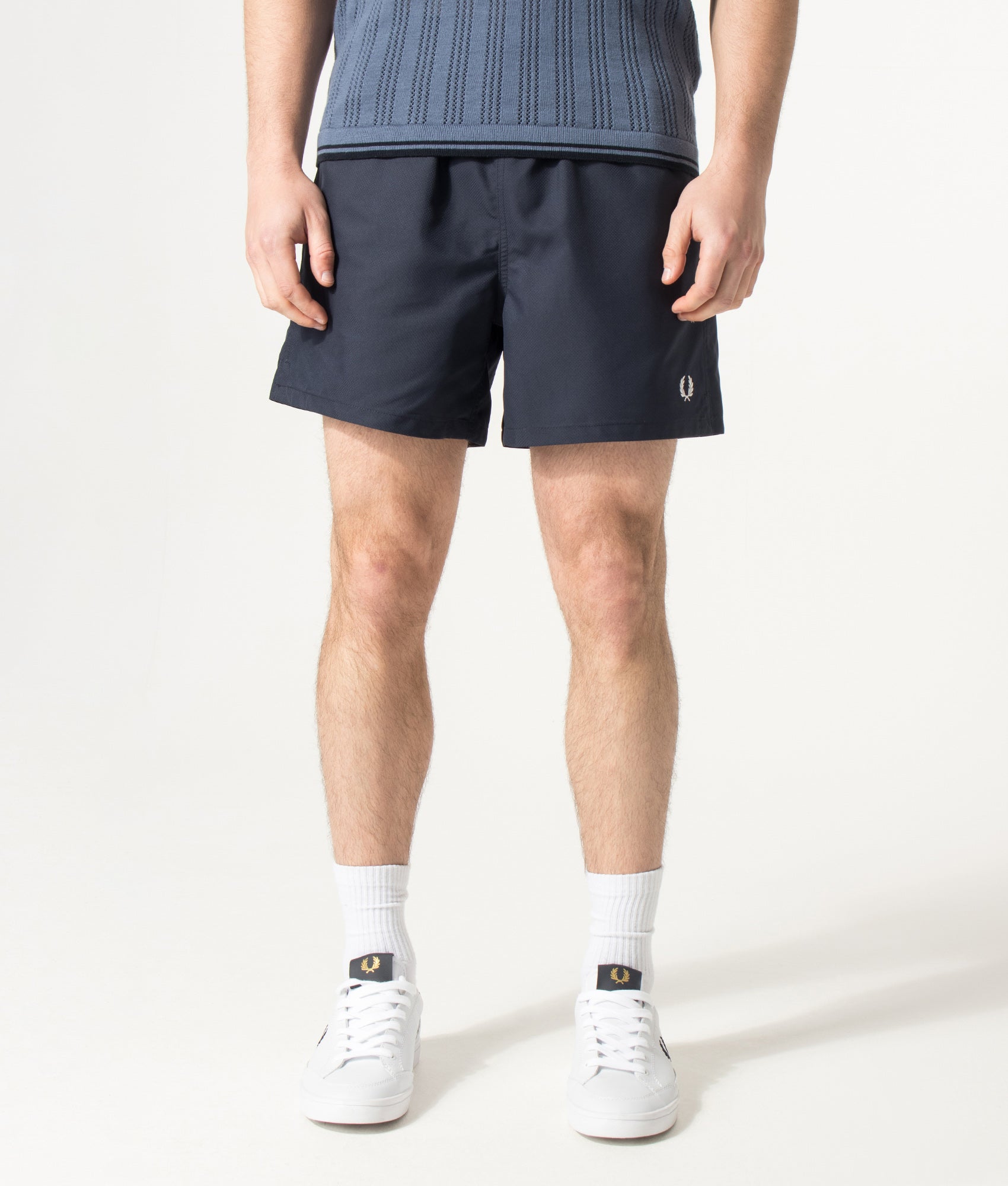 Fred Perry Swimshorts in Navy at EQVVS Menswear. Model front shot.