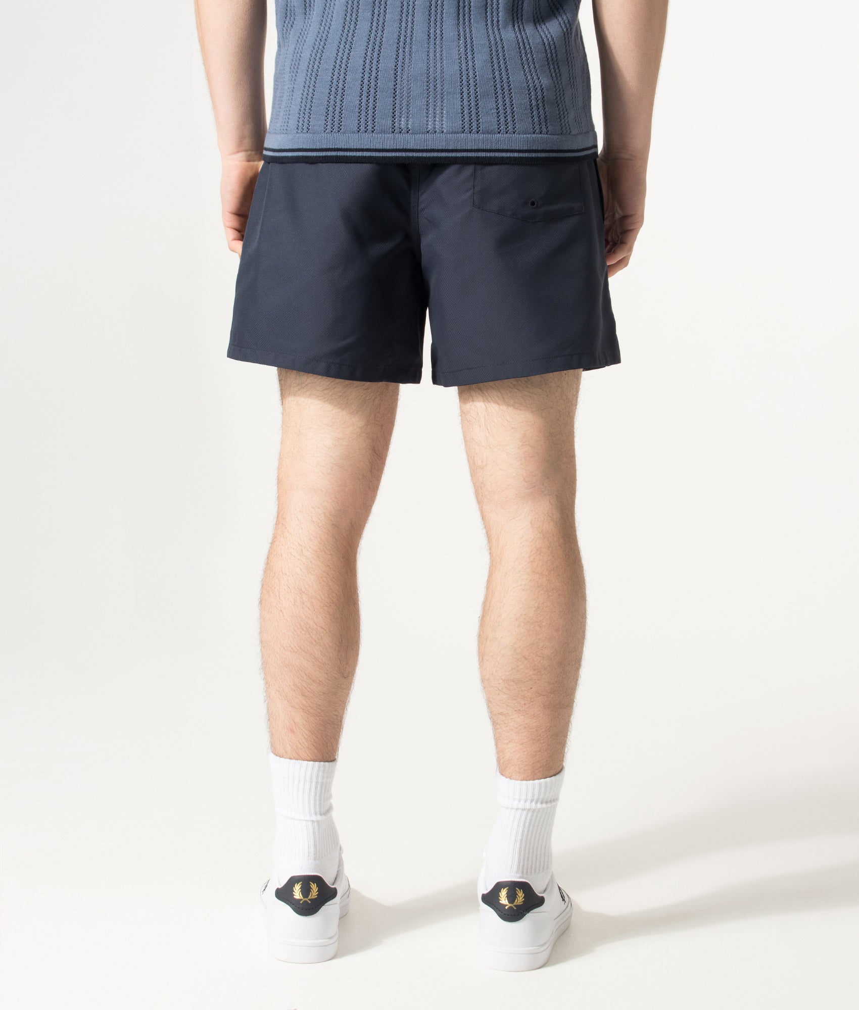 Fred Perry Swimshorts in Navy at EQVVS Menswear. Model back shot.