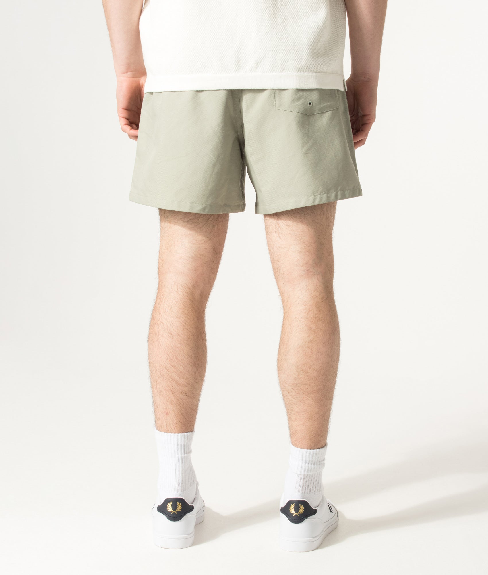 Fred Perry Swimshorts in Seagrass at EQVVS Menswear. Model back shot.