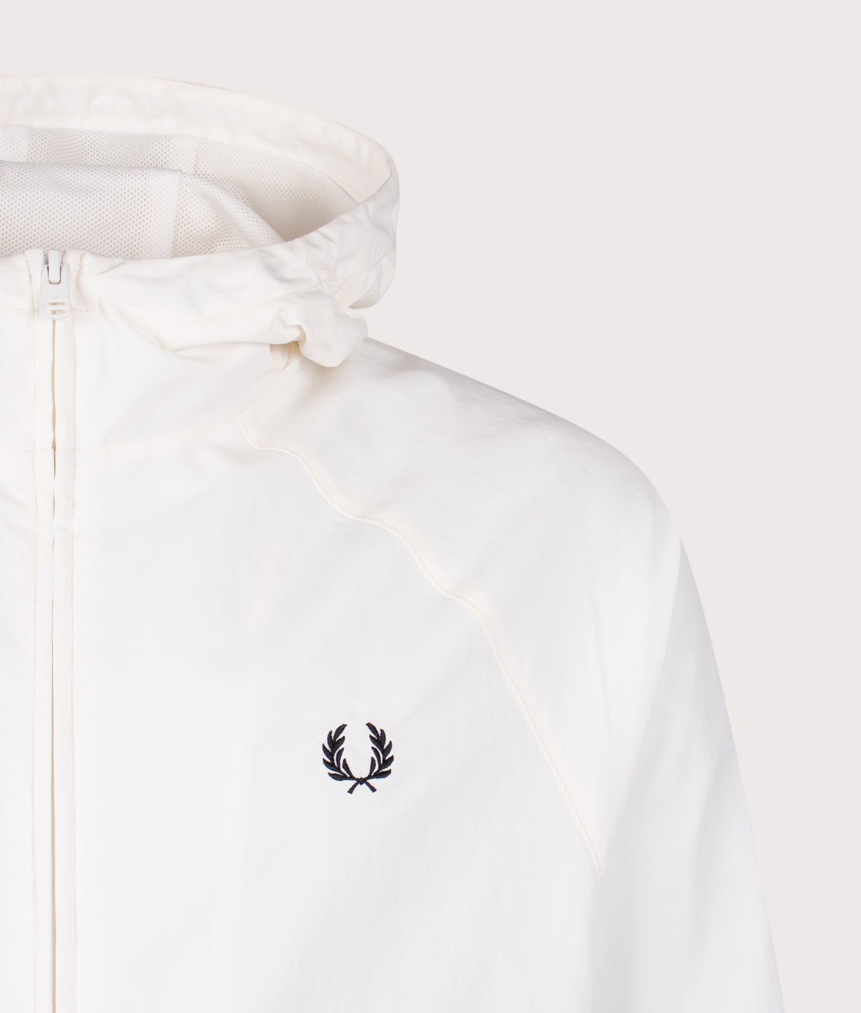 Fred Perry Hooded Shell Jacket in Snow White at EQVVS Menswear. Detail shot.