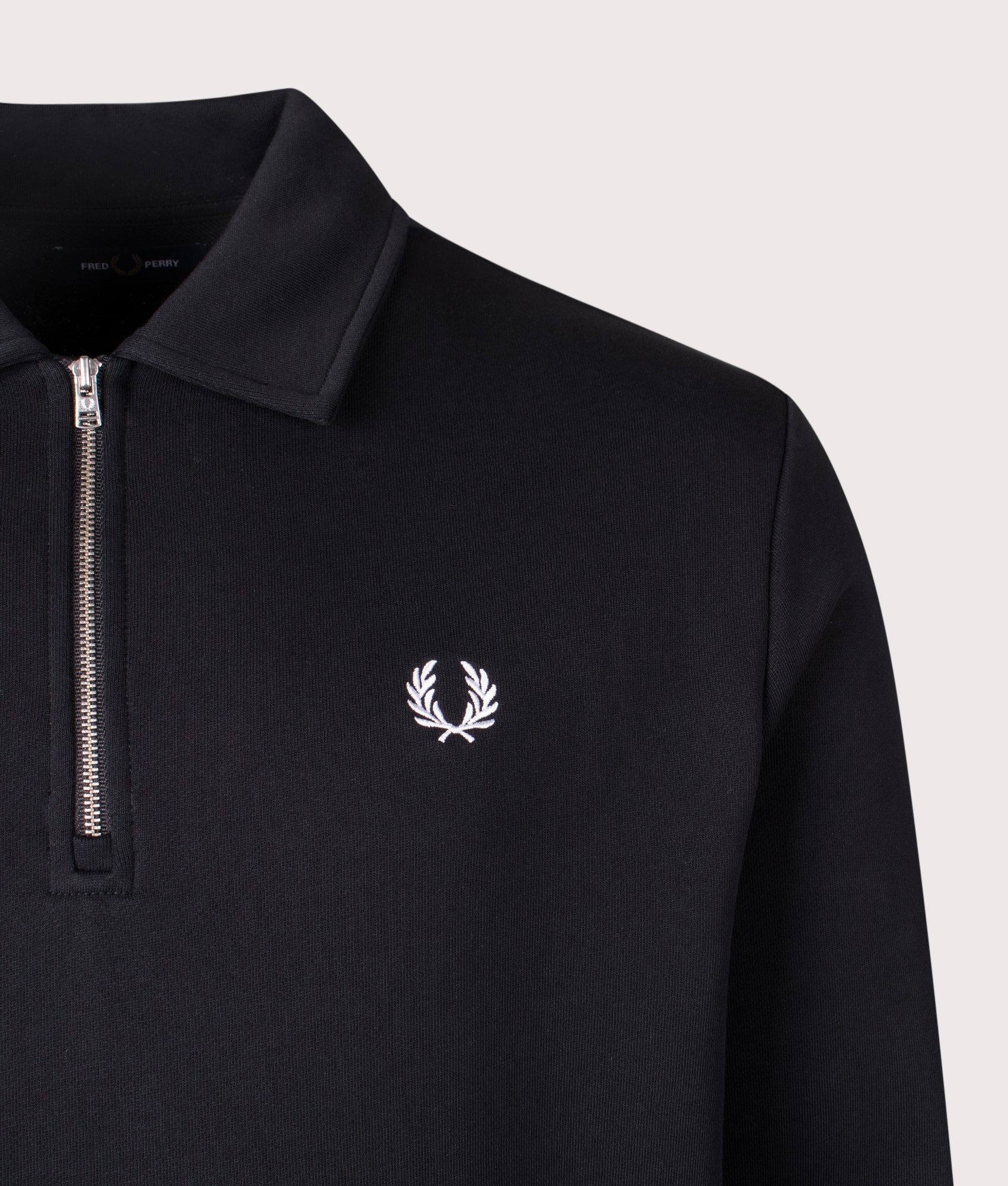 Fred Perry Quarter Zip Collared Sweatshirt in Black at EQVVS Menswear. Detail shot.