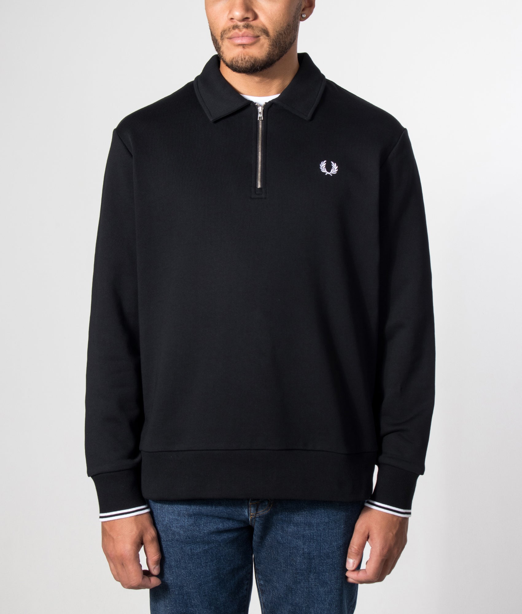 Fred Perry Quarter Zip Collared Sweatshirt in Black at EQVVS Menswear. Model front shot.