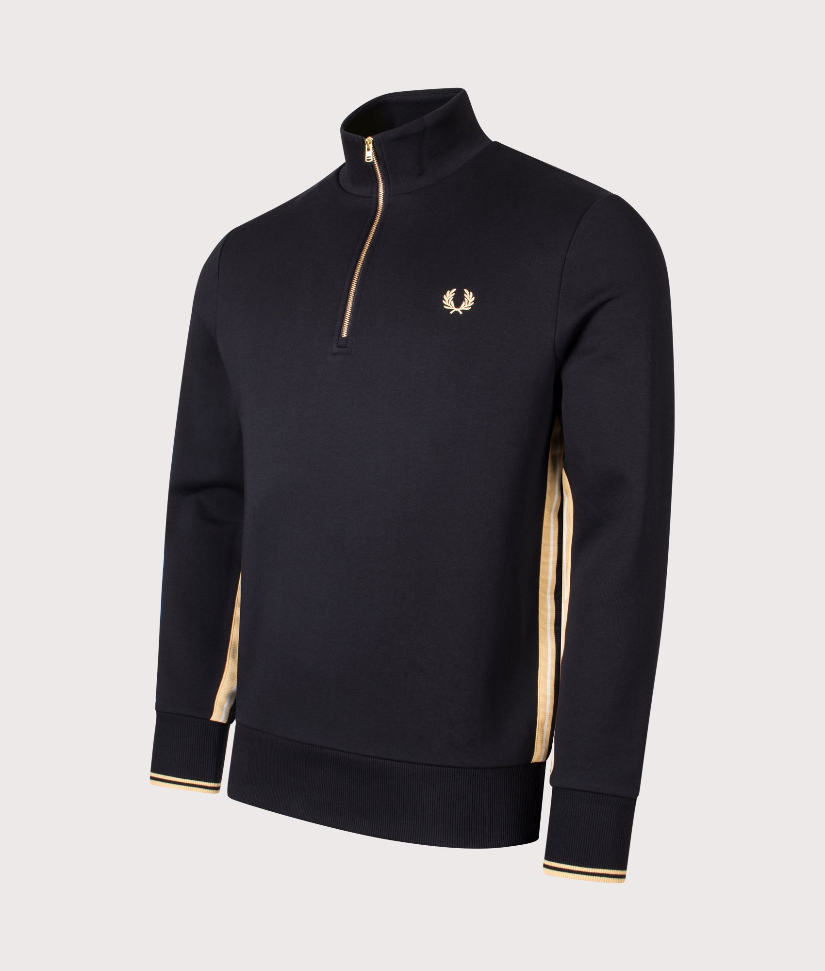 Fred Perry Stripe Tape Quarter Zip Sweatshirt in Black and Champagne at EQVVS Menswear. Angled front shot.