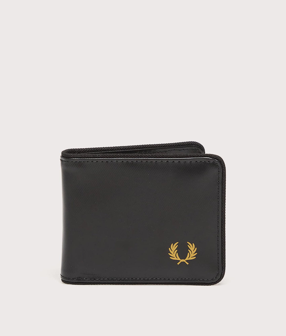 Fred Perry Tonal Coated Polyester Billfold Wallet in Black and Gold at EQVVS Menswear. Front shot.