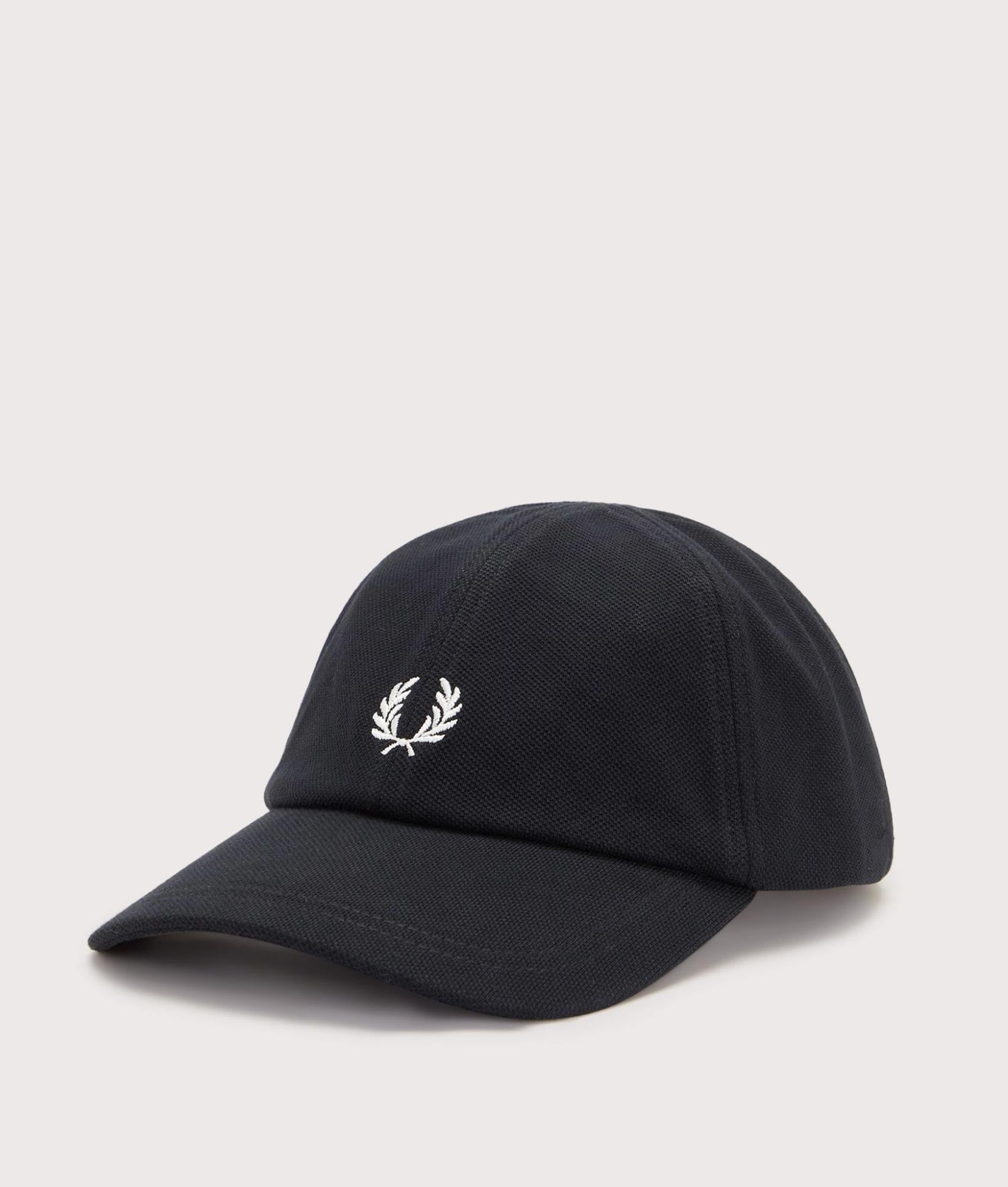 Fred Perry Piqué Classic Cap in Black and Snow White at EQVVS Menswear. Angled front shot.