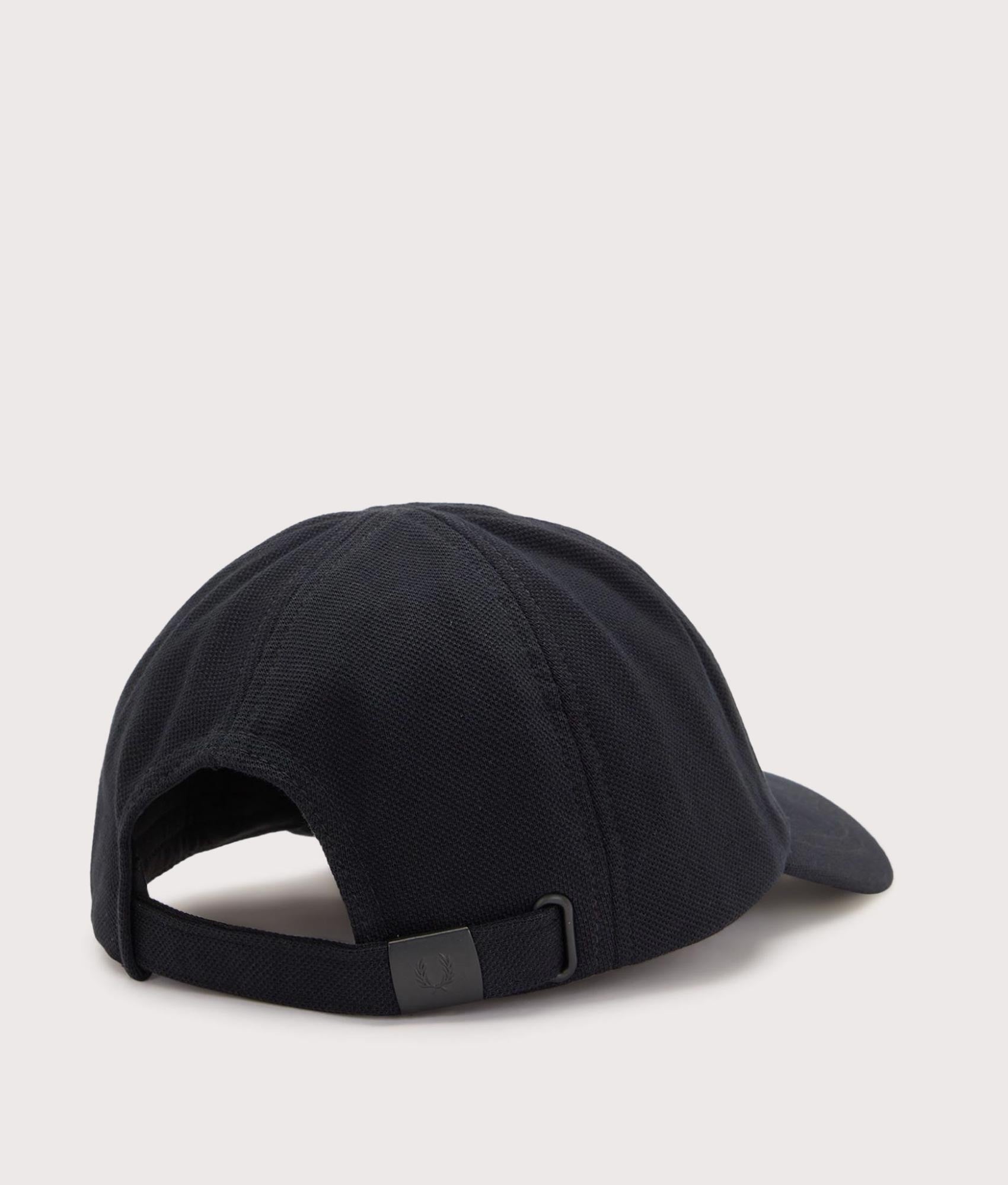 Fred Perry Piqué Classic Cap in Black and Snow White at EQVVS Menswear. Angled back shot.