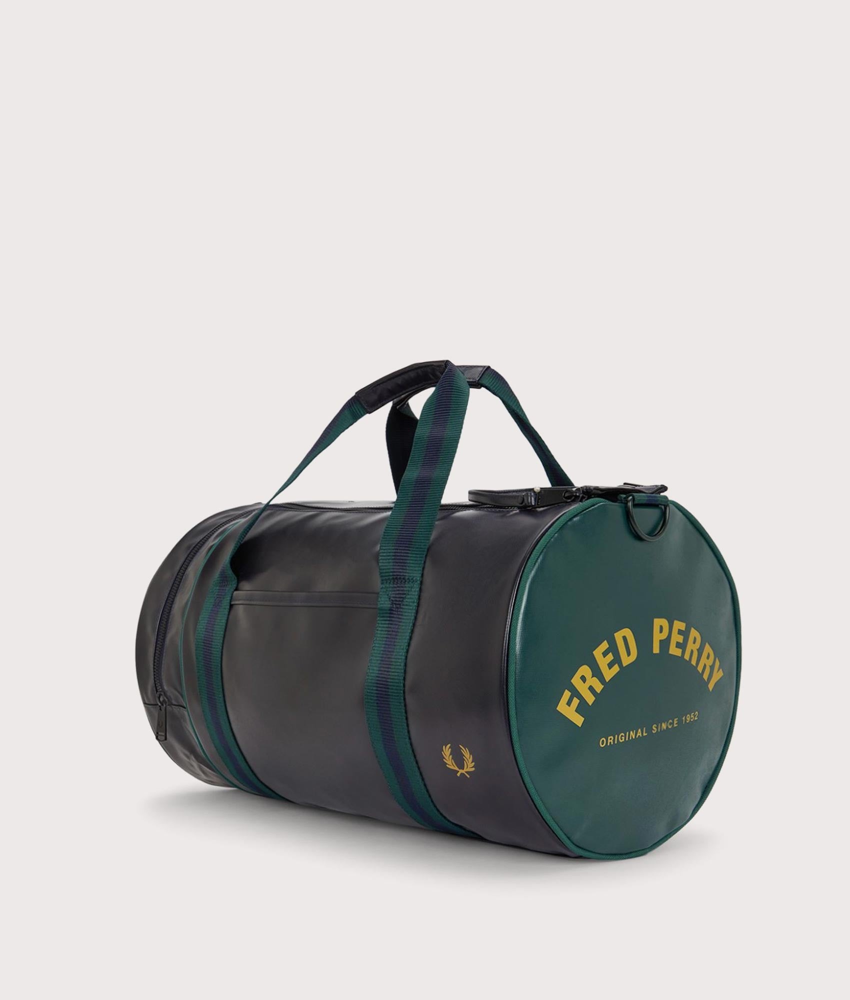 Fred Perry Classic Barrel Bag in Navy and Grassroots at EQVVS Menswear. Angled front shot.
