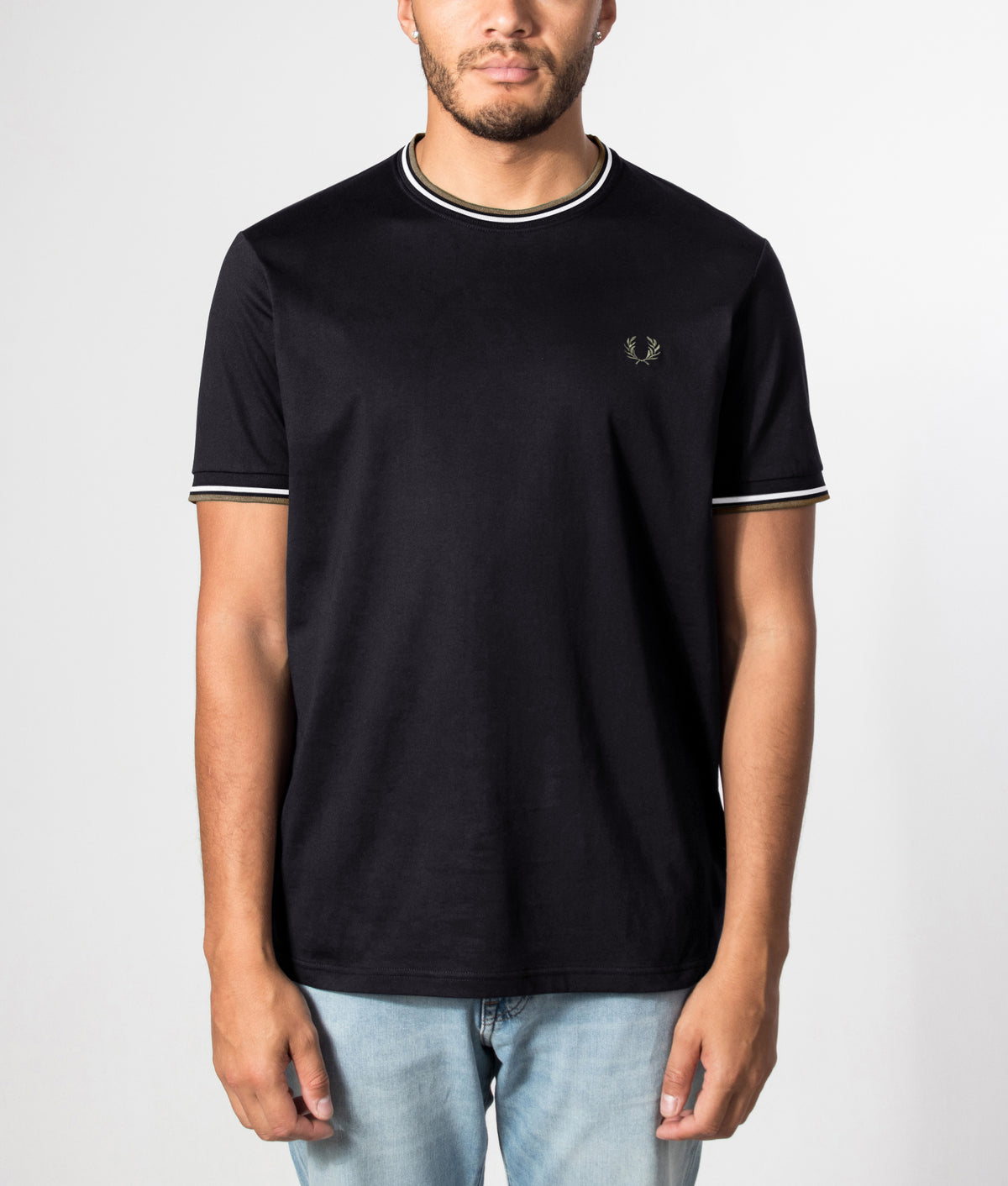 Fred Perry Twin Tipped T-Shirt in Black, Ecru and Laurel Wreath Green at EQVVS Menswear. Front model shot.