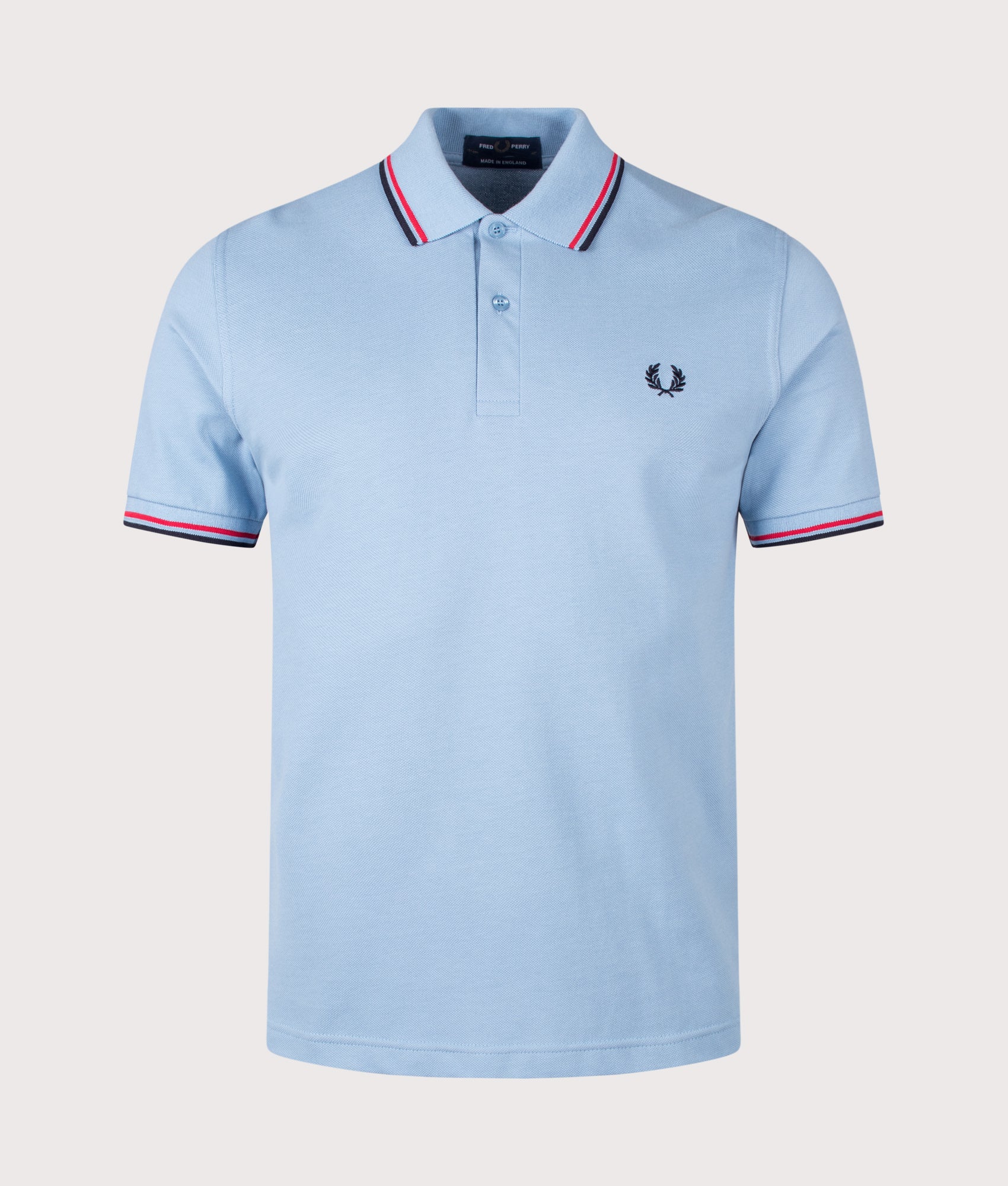 Fred Perry M12 Twin Tipped Fred Perry Polo Shirt in Sky, Red and Navy at EQVVS Menswear. Front shot.