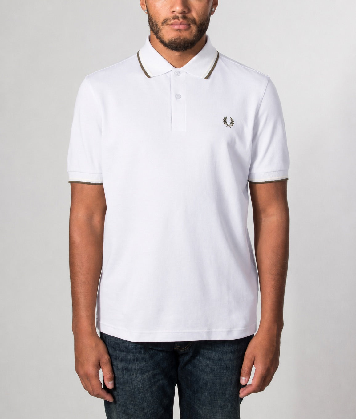 Fred Perry Twin Tipped Polo Shirt in Dusky Blue, Ecru and Laurel Wreath Green at EQVVS Menswear. Model front shot.