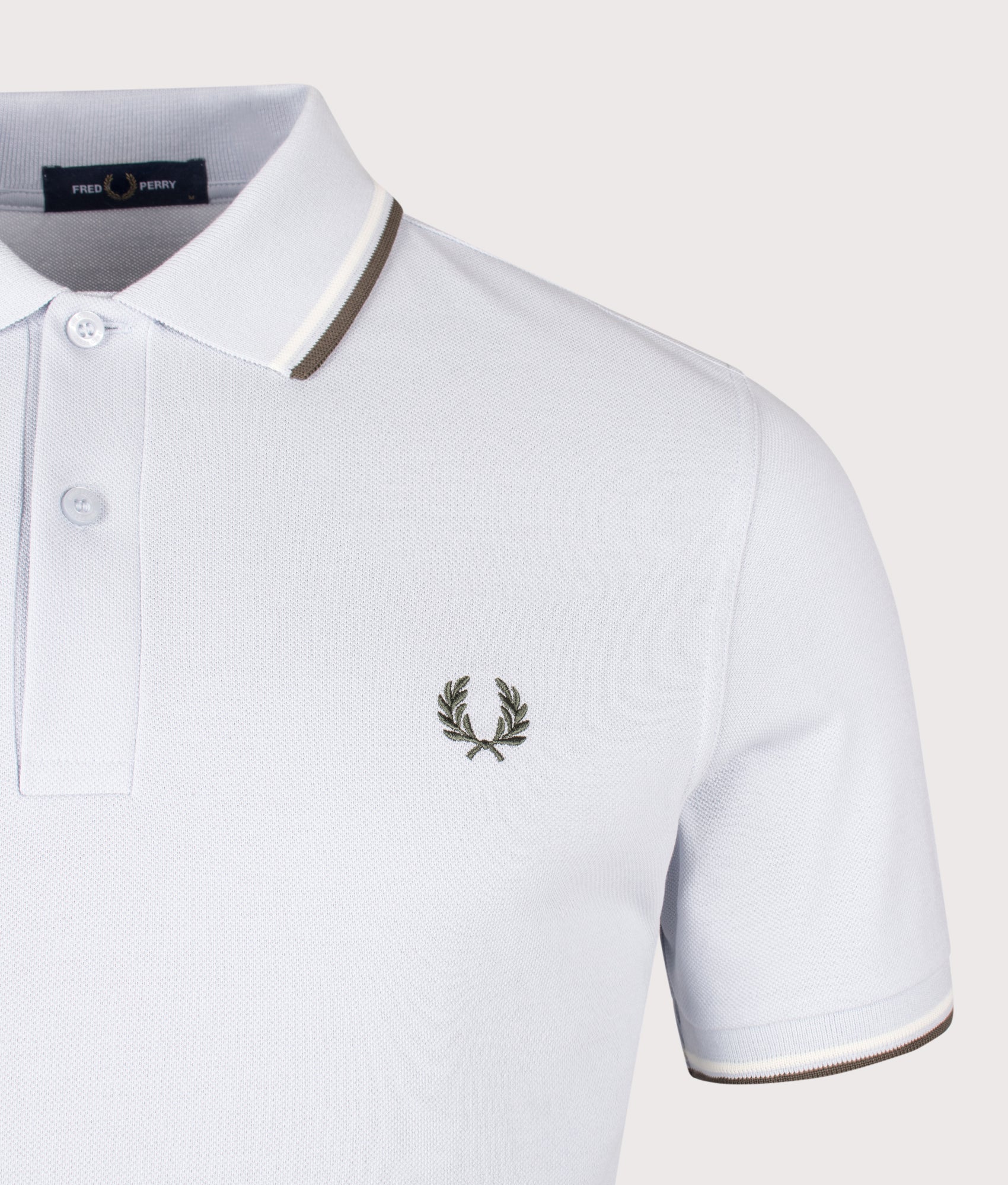 Fred Perry Twin Tipped Polo Shirt in Dusky Blue, Ecru and Laurel Wreath Green at EQVVS Menswear. Detail shot.