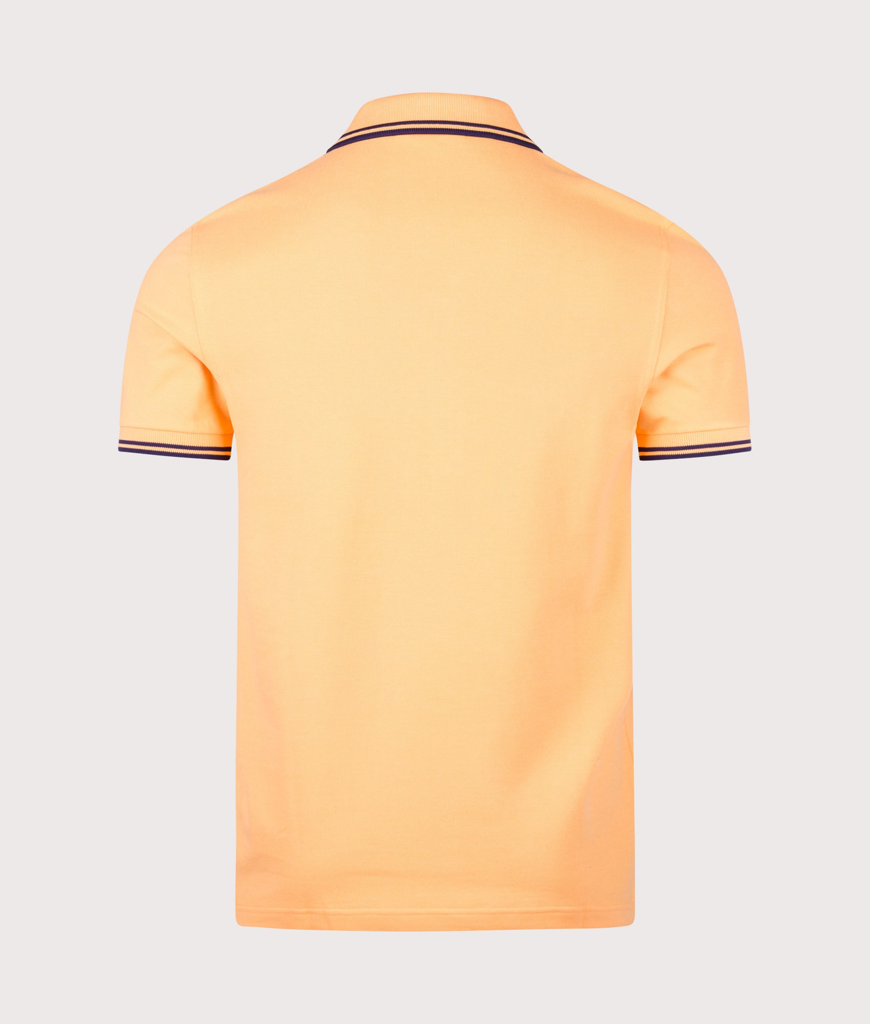 Fred Perry Twin Tipped Polo Shirt in Peach and French Navy at EQVVS Menswear. Back shot.