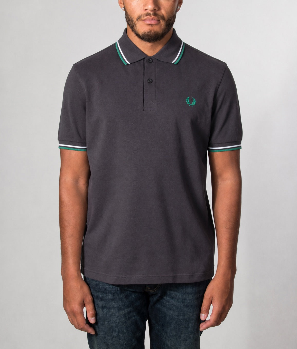 Fred Perry Twin Tipped Polo Shirt in Anchor Grey, Light Ice and Sport Green at EQVVS Menswear. Model front shot.