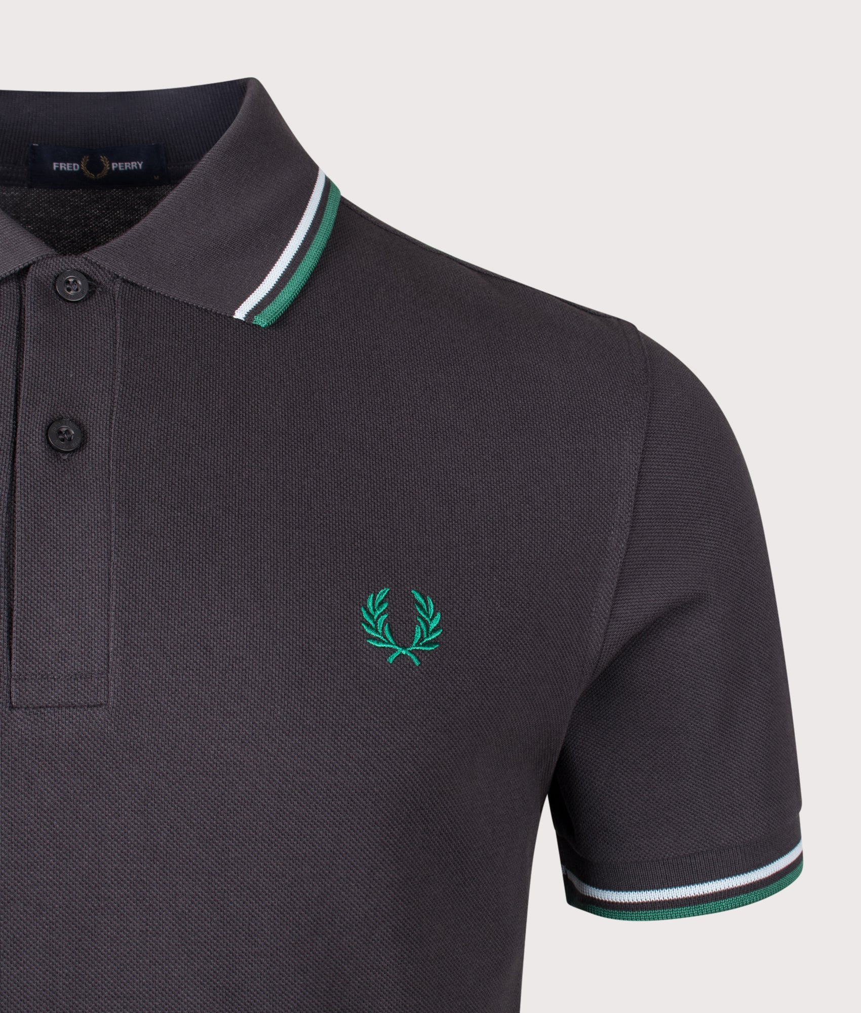 Fred Perry Twin Tipped Polo Shirt in Anchor Grey, Light Ice and Sport Green at EQVVS Menswear. Detail shot.