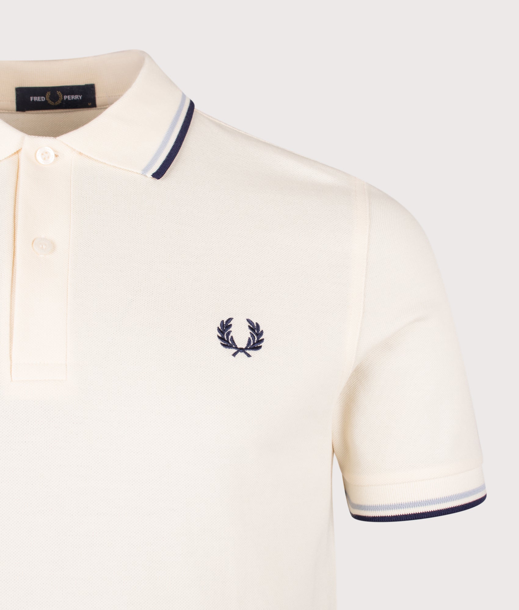 Fred Perry Twin Tipped Polo Shirt in Ecru, Dusky Blue and French Navy at EQVVS Menswear. Detail shot.