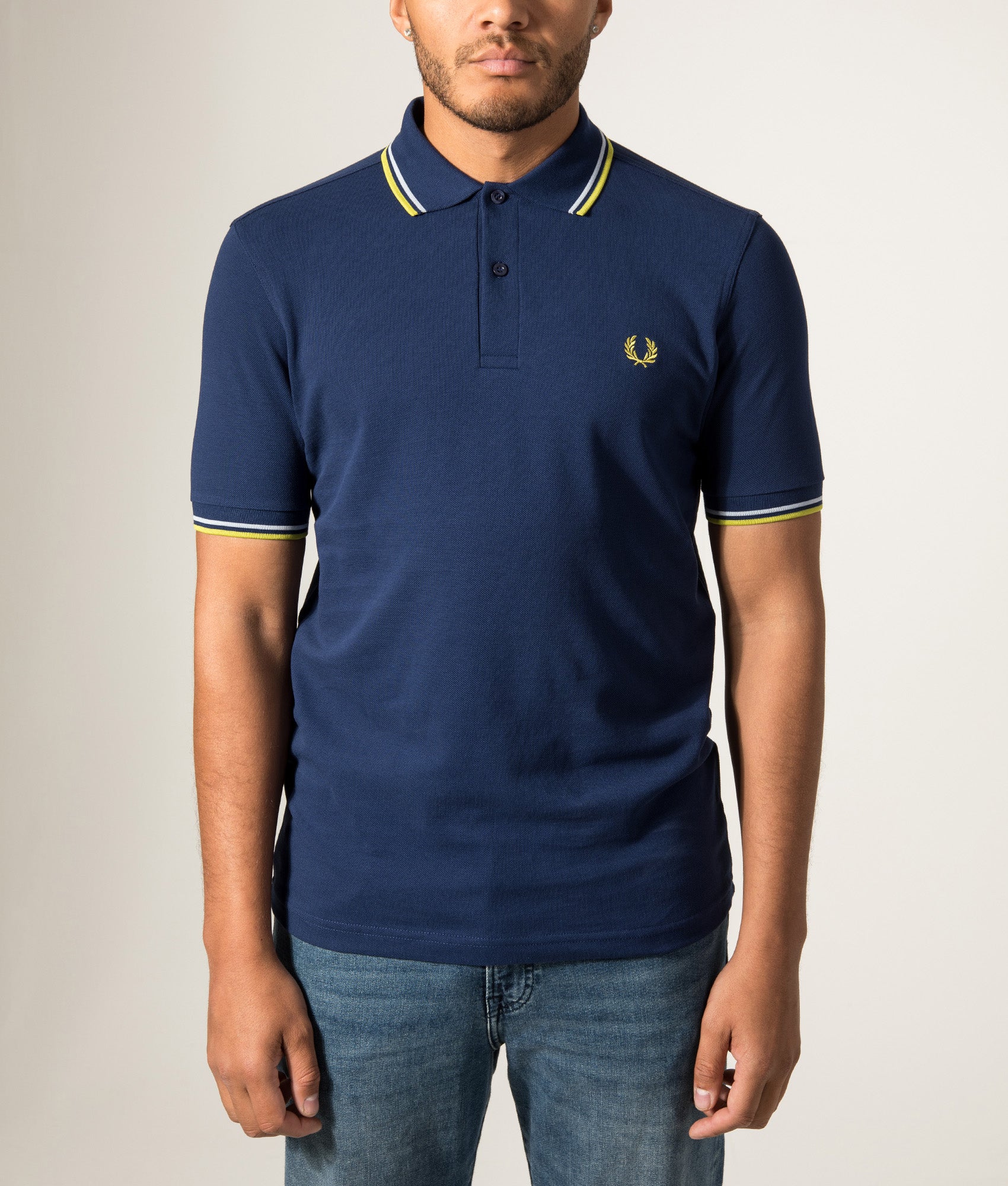 Fred Perry Twin Tipped Polo Shirt in French Navy, Dusky Blue and Citron at EQVVS Menswear. Model front shot.