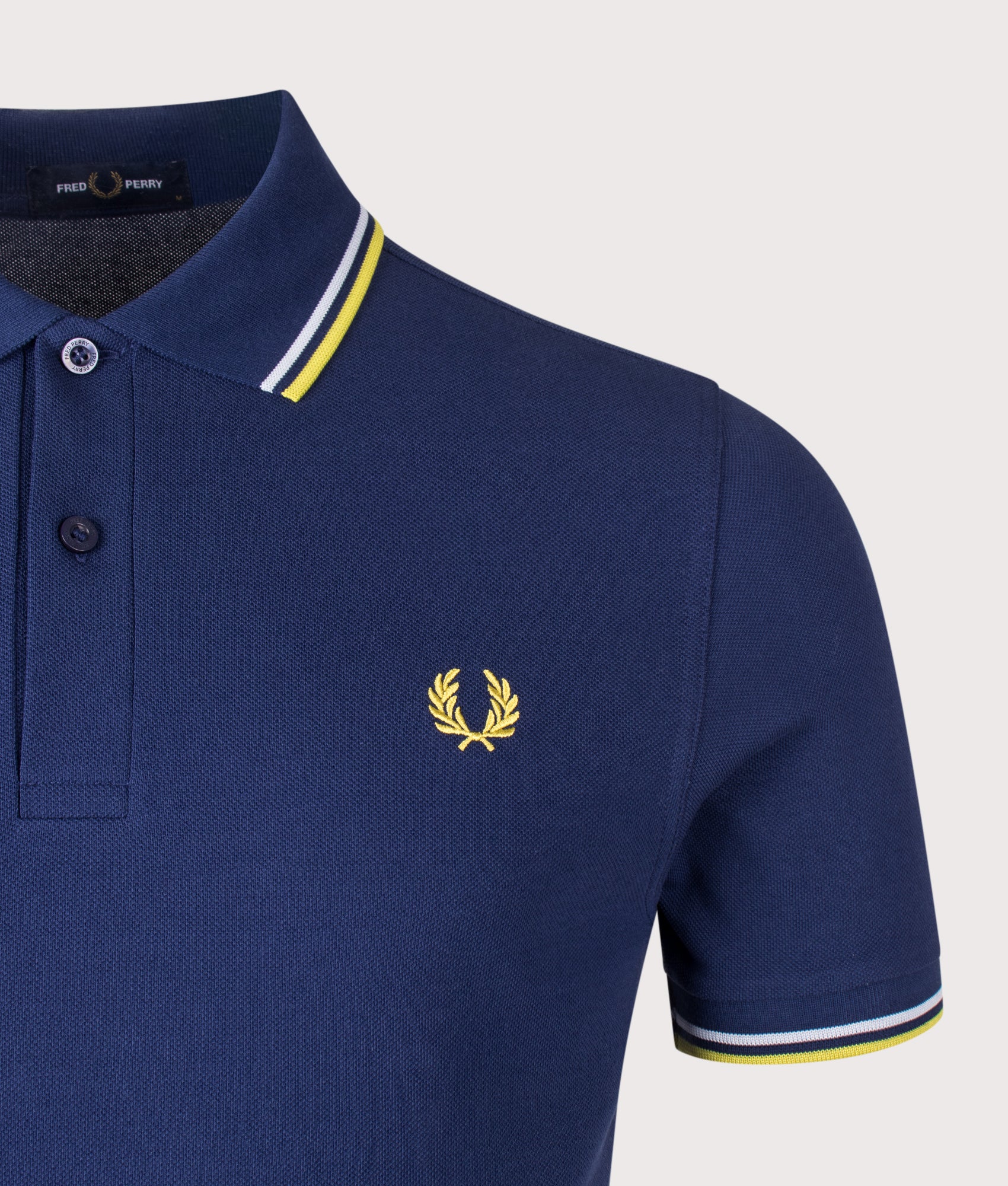 Fred Perry Twin Tipped Polo Shirt in French Navy, Dusky Blue and Citron at EQVVS Menswear. Detail shot.
