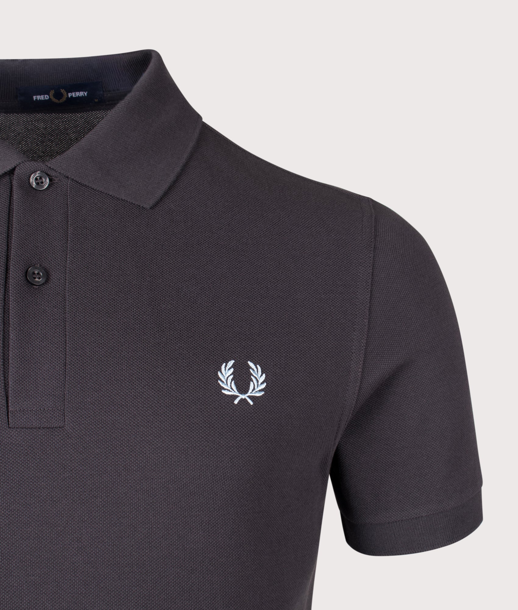 Fred Perry the The Fred Perry Polo Shirt in Anchor Grey and Light Ice at EQVVS Menswear. Detail shot.