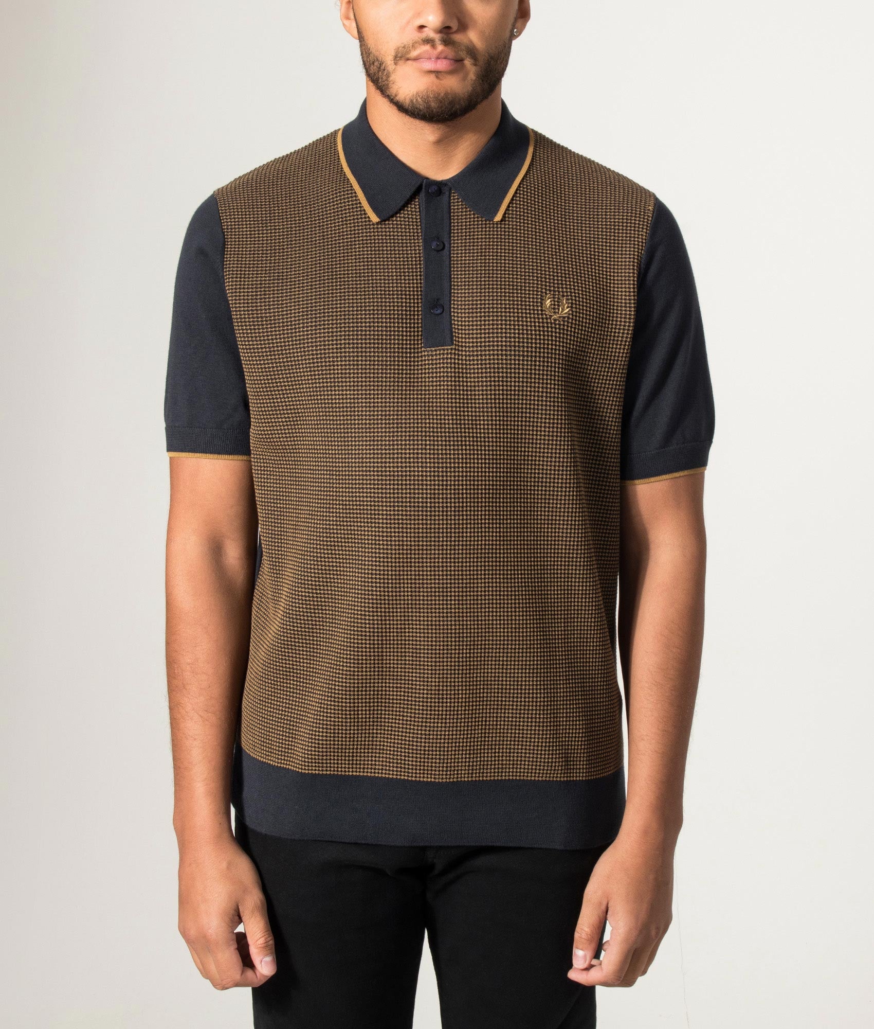 Fred Perry Tonic Waffle Knitted Polo Shirt in Navy at EQVVS Menswear. Model front shot.