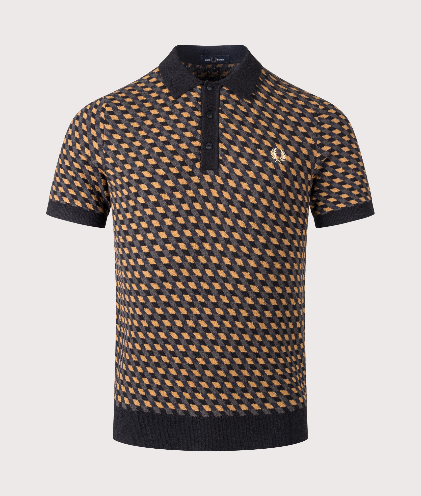 Fred Perry Geometric Knitted Polo Shirt in Dark Caramel at EQVVS Menswear. Front shot.