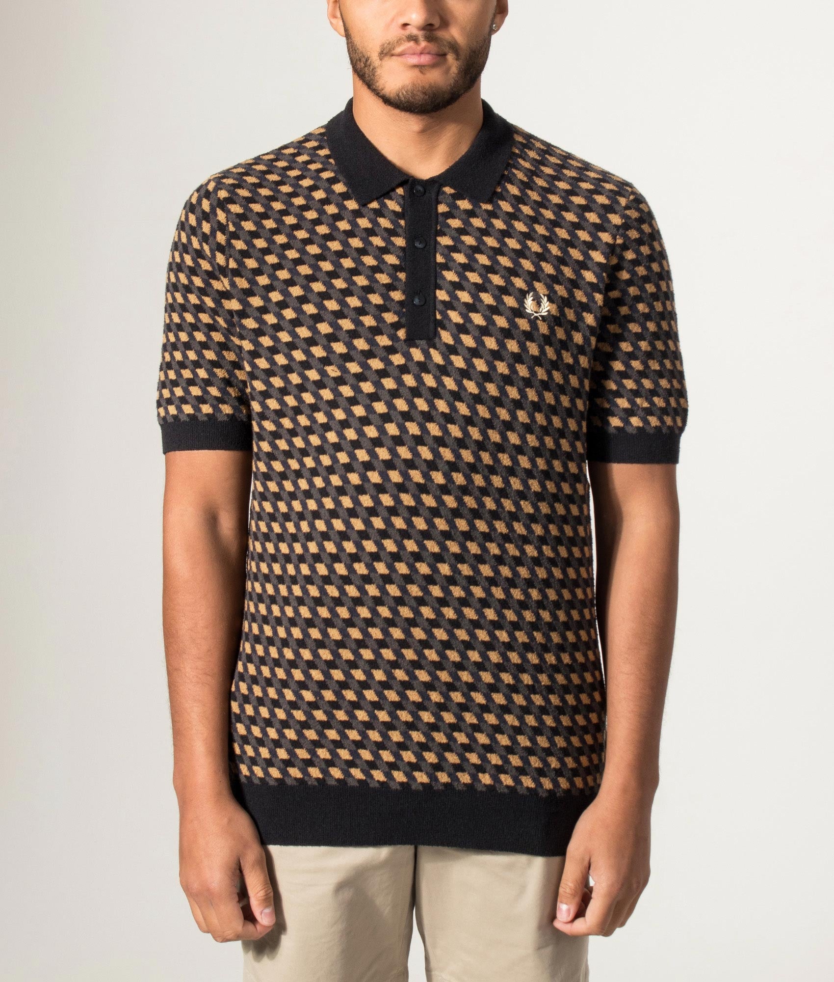 Fred Perry Geometric Knitted Polo Shirt in Dark Caramel at EQVVS Menswear. Model front shot.