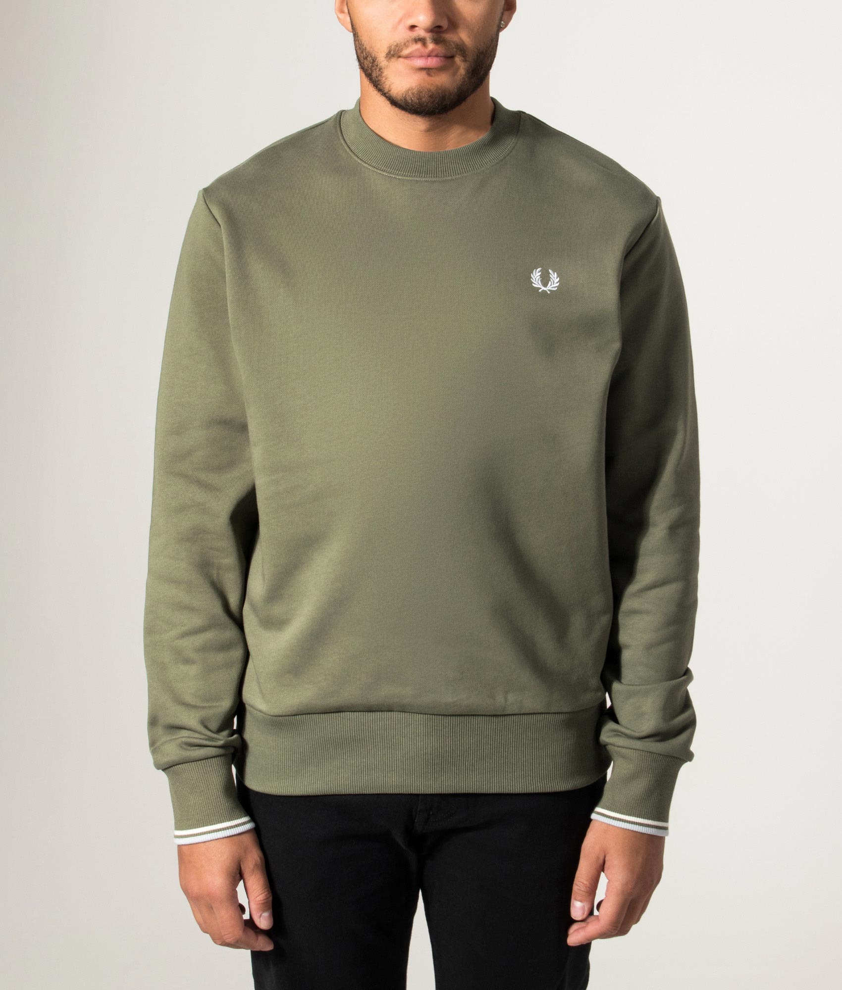 Fred Perry Crew Neck Sweatshirt in Laurel Wreath Green, Ecru and Dusky Blue at EQVVS Menswear. Model front shot.