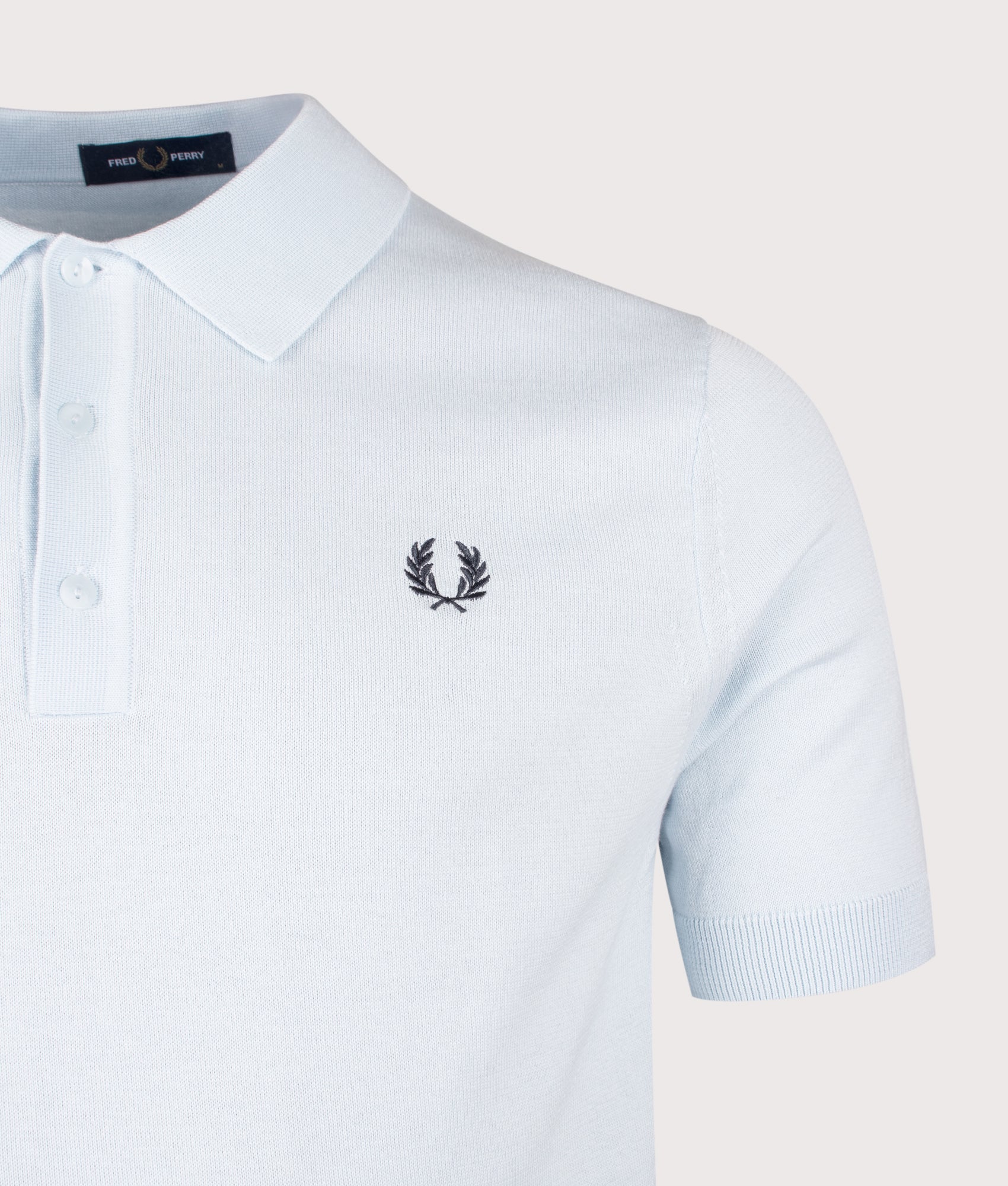 Fred Perry Long Staple Cotton Knitted Polo Shirt in Light Ice at EQVVS Menswear. Detail shot.