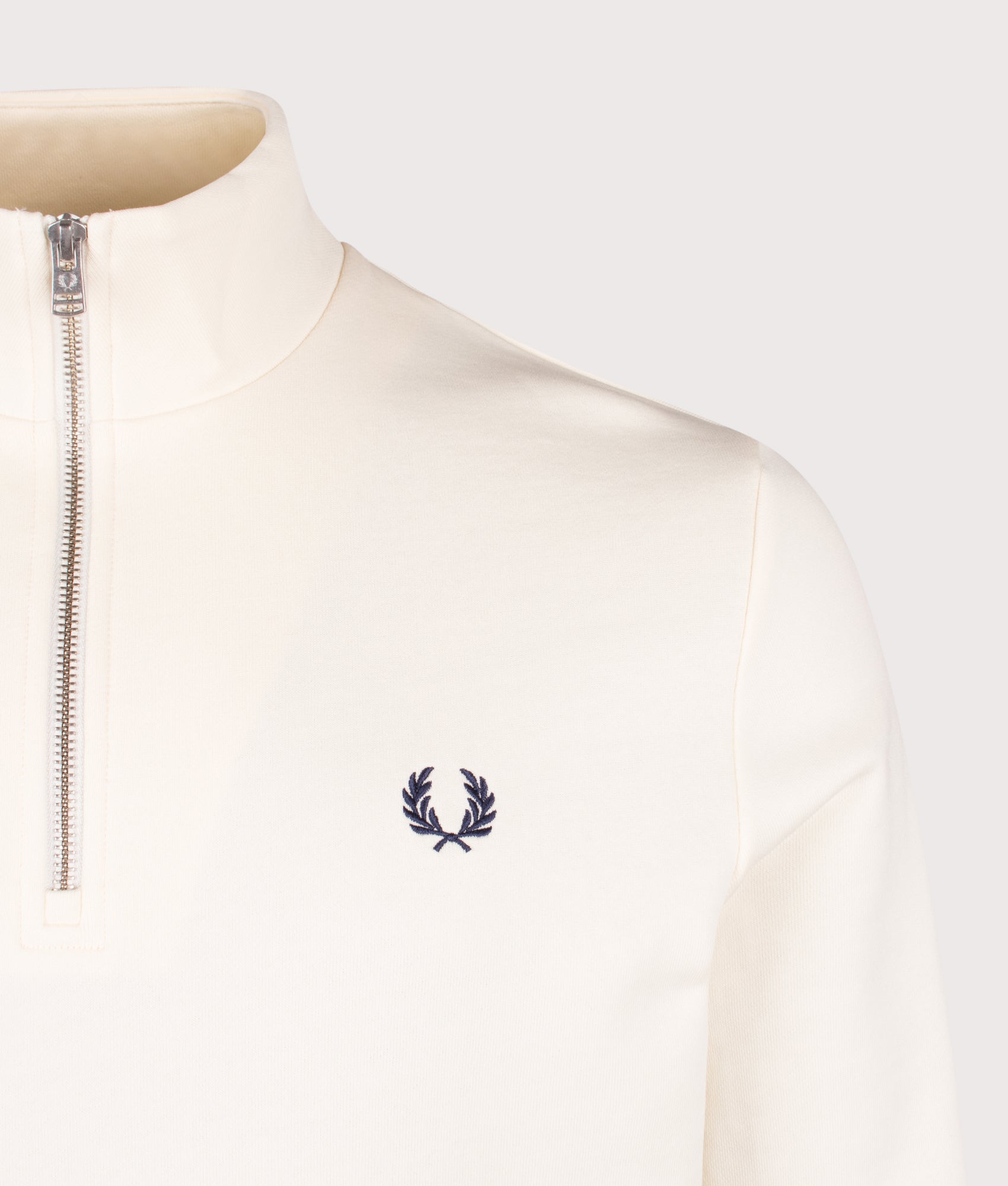 Fred Perry Quarter Zip Sweatshirt in Ecru, Dusky Blue and French Navy at EQVVS Menswear. Detail shot.